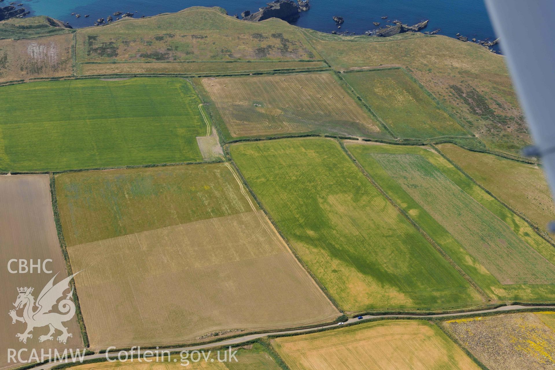 Aerial photography of Non, arch cropmarks between West Hook and Martins Haven Aerial reconnaissance survey for the CHERISH Project. Crown Copyright: CHERISH PROJECT 2018. Produced with EU funds through the Ireland Wales Co-operation Programme 2014-2020. All material made freely available through the Open Government Licence.