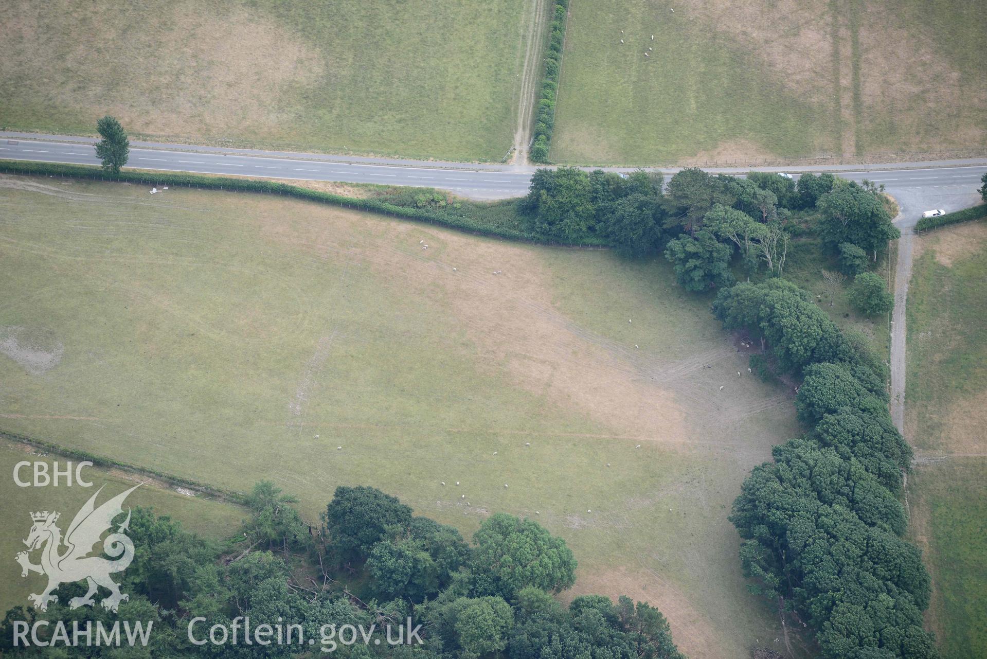 Aerial photograph: Croes Faen, cropmarks of square barrow cemetery. Crown: CHERISH PROJECT 2018. Produced with EU funds through the Ireland Wales Co-operation Programme 2014-2020 (NGR SH598018)