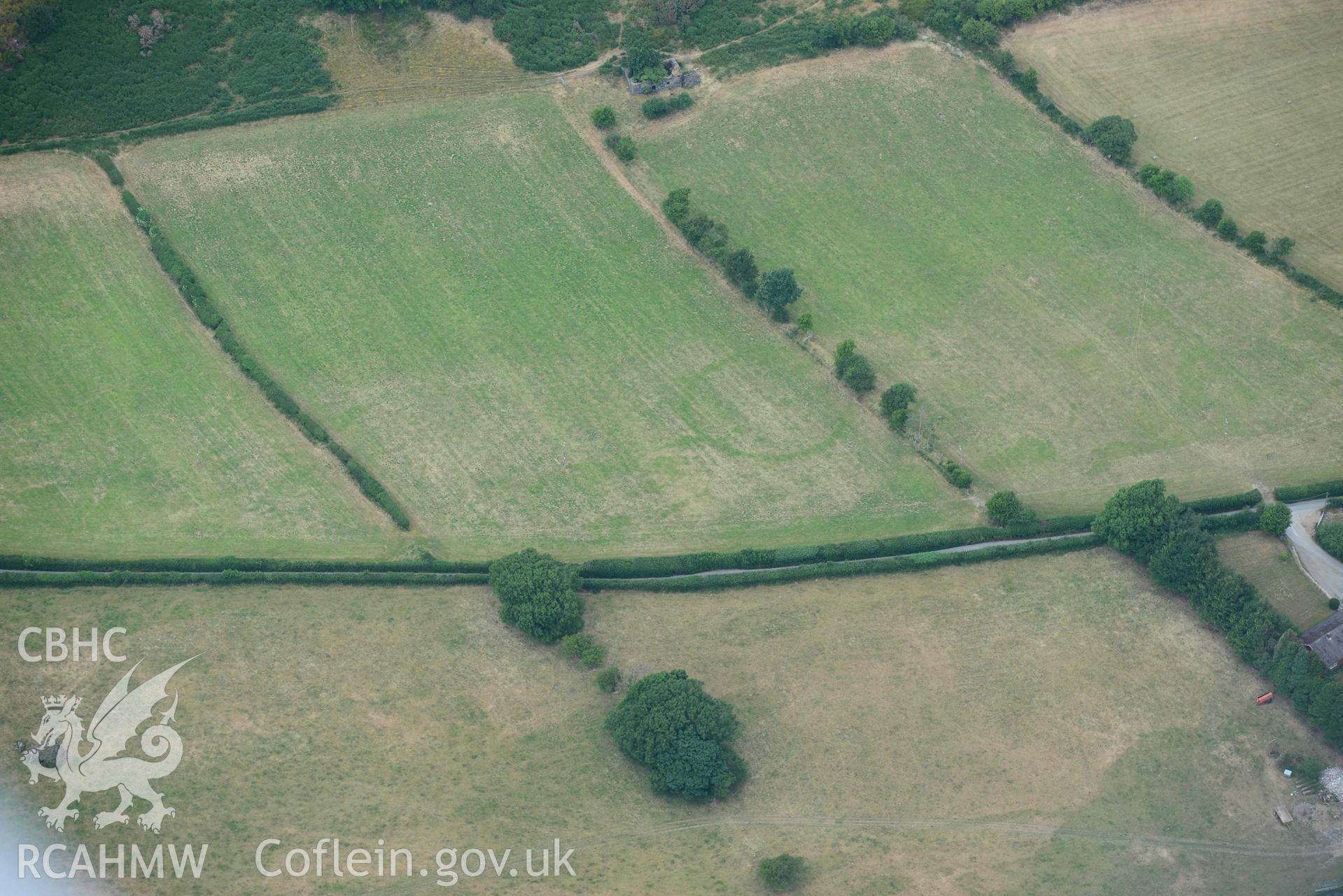 Aerial photograph: Allt-lwyd, Cwm Maethlon round barrow cropmarks. Crown: CHERISH PROJECT 2018. Produced with EU funds through the Ireland Wales Co-operation Programme 2014-2020 (NGR SH631985)