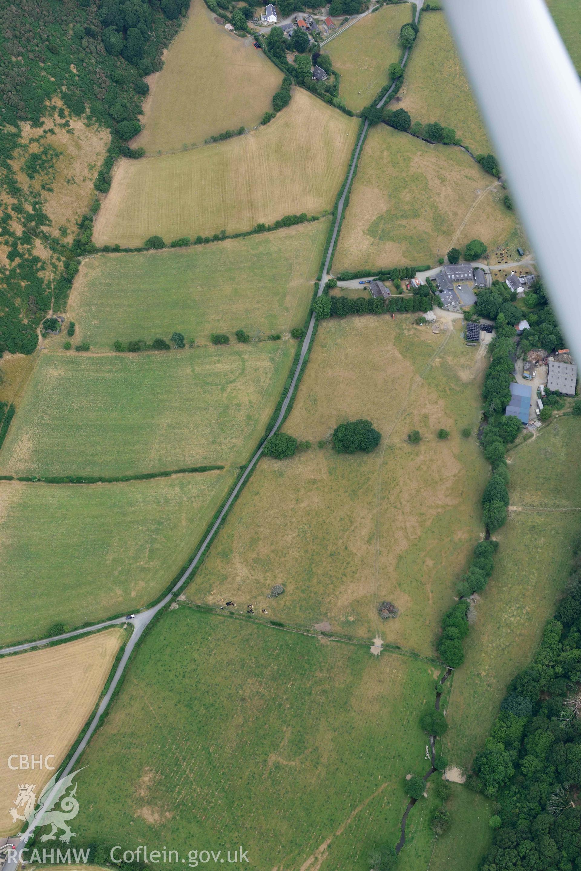 Aerial photograph: Allt-lwyd, Cwm Maethlon round barrow cropmarks. Crown: CHERISH PROJECT 2018. Produced with EU funds through the Ireland Wales Co-operation Programme 2014-2020 (NGR SH631985)