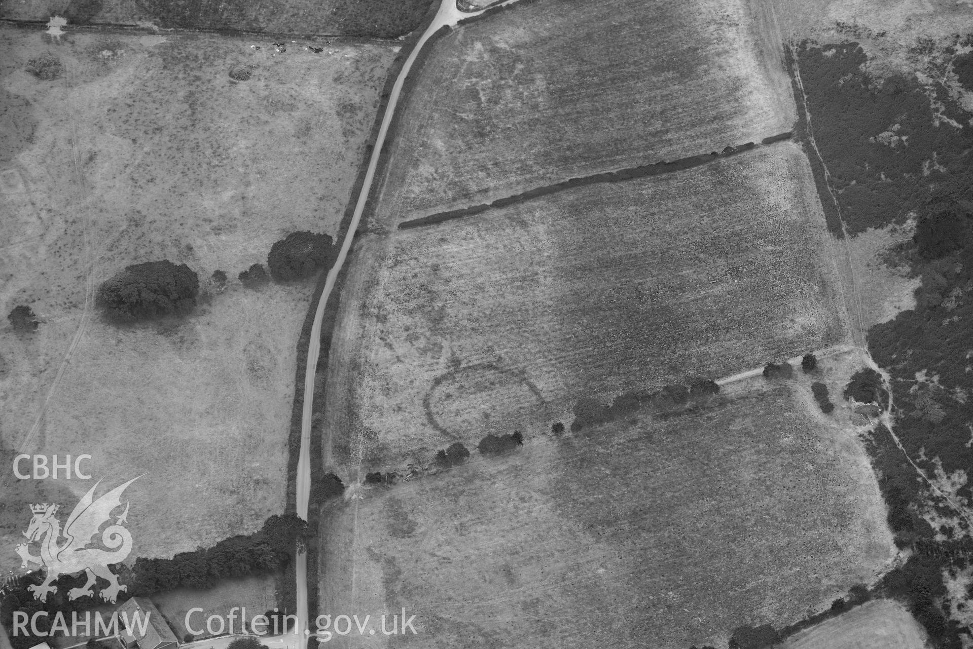 Aerial photograph: Allt-lwyd, Cwm Maethlon round barrow cropmarks. Crown: CHERISH PROJECT 2018. Produced with EU funds through the Ireland Wales Co-operation Programme 2014-2020 (NGR SH631985)