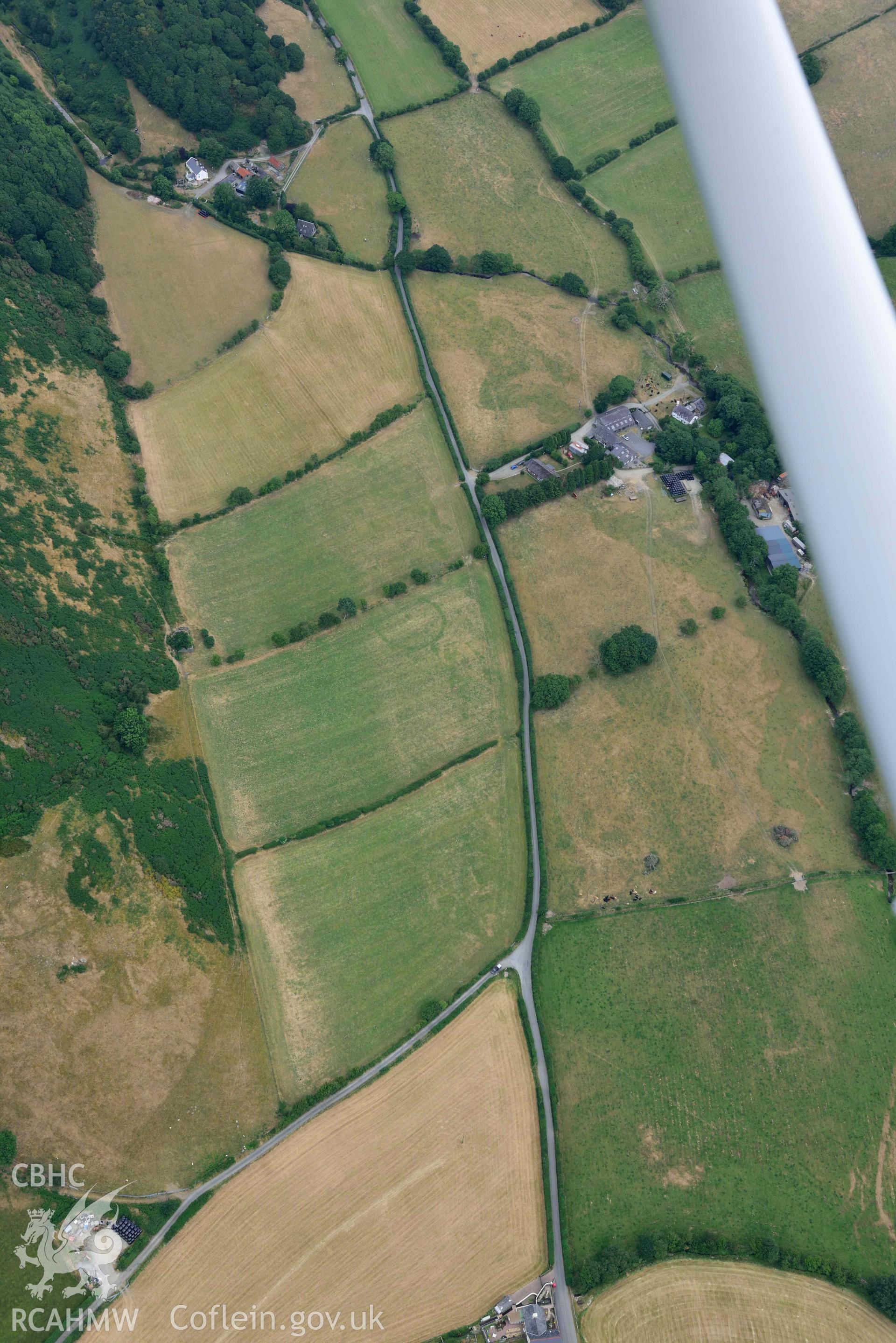 Aerial photograph: Dyffryn Gwyn tumulus, with parching. Crown: CHERISH PROJECT 2018. Produced with EU funds through the Ireland Wales Co-operation Programme 2014-2020 (NGR SH628984)