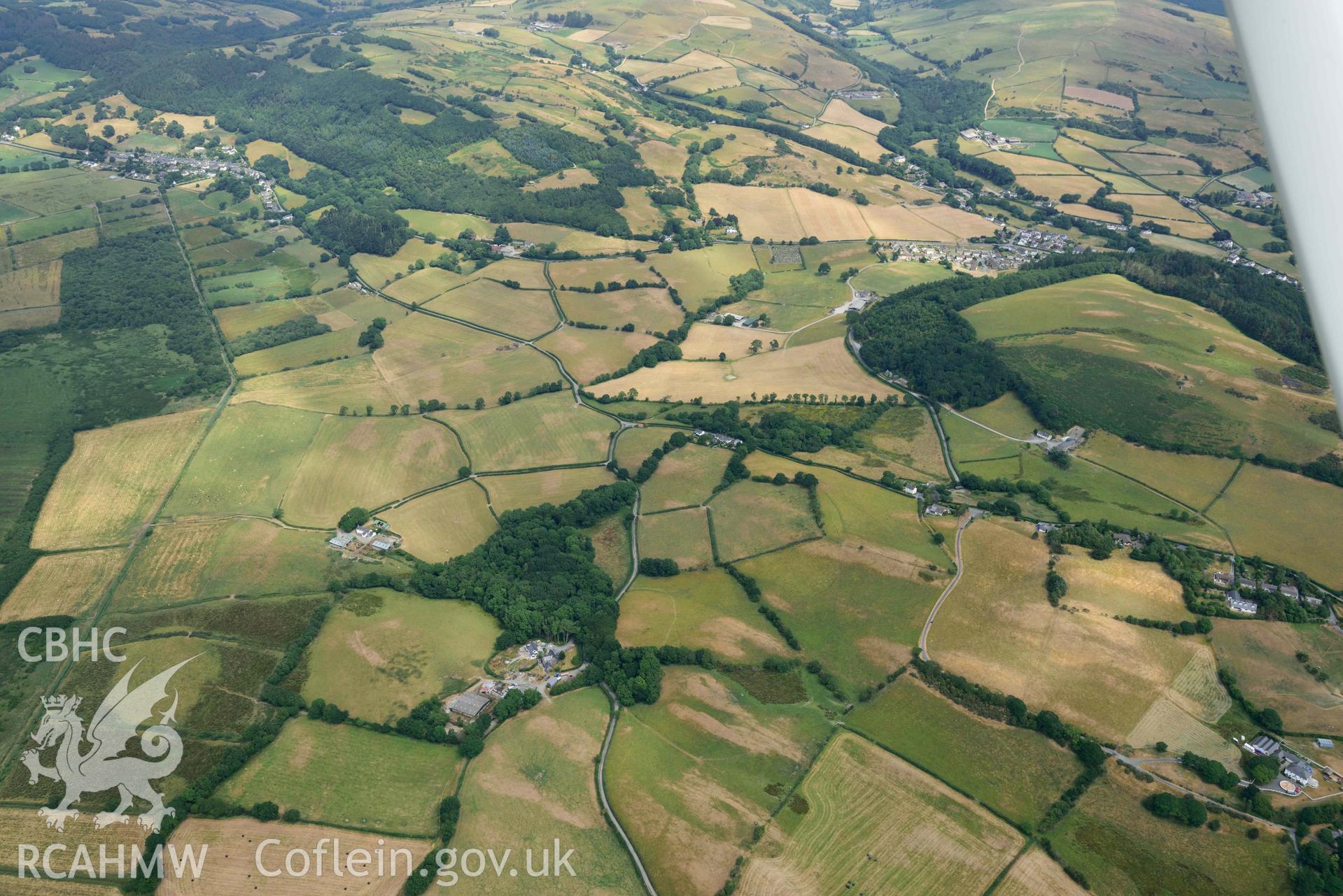 Aerial photograph: Pentre-bach; general survey of non-archaeological parchmarks in fields west of Pentre-bach. View from west. Crown: CHERISH PROJECT 2018. Produced with EU funds through the Ireland Wales Co-operation Programme 2014-2020 (NGR SN644900)