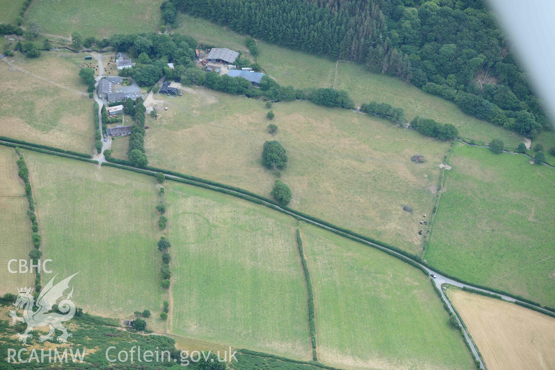 Aerial photograph: Allt-lwyd, Cwm Maethlon round barrow cropmarks. Crown: CHERISH PROJECT 2018. Produced with EU funds through the Ireland Wales Co-operation Programme 2014-2020 (NGR SH631985)