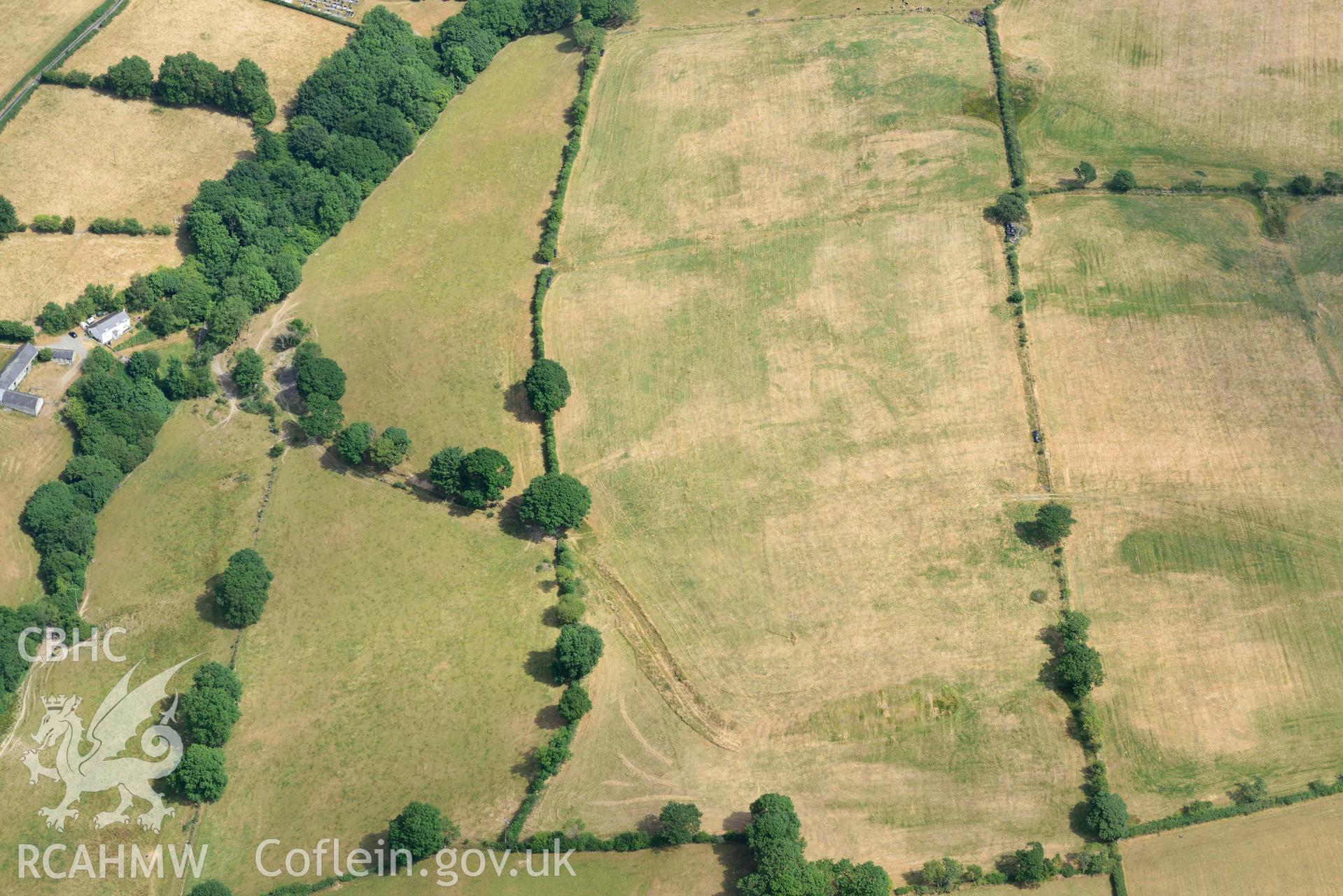 Aerial photograph: Gellifadog defended enclosure cropmark, view from west. Crown: CHERISH PROJECT 2018. Produced with EU funds through the Ireland Wales Co-operation Programme 2014-2020 (NGR SN654821)