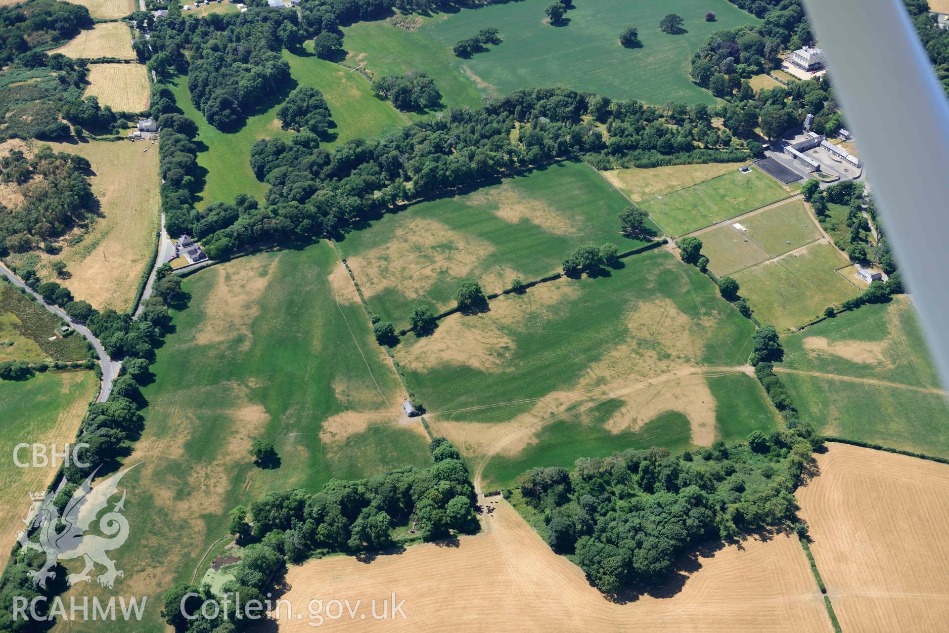 Aerial photograph: Broom Hall parkland; sundry cropmarks of relict field systems to south-east of stables. Crown: CHERISH PROJECT 2018. Produced with EU funds through the Ireland Wales Co-operation Programme 2014-2020 (NGR SH416369)