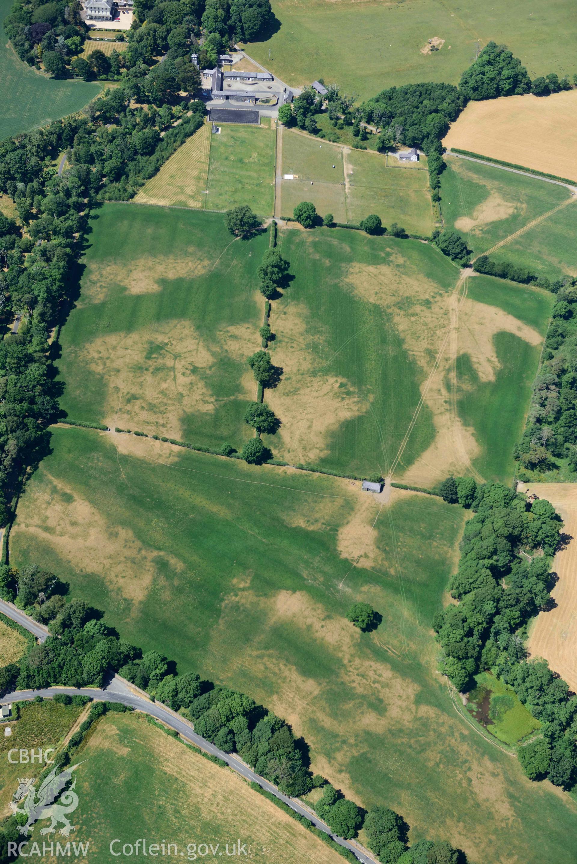 Aerial photograph: Broom Hall parkland; sundry cropmarks of relict field systems to south-east of stables. Crown: CHERISH PROJECT 2018. Produced with EU funds through the Ireland Wales Co-operation Programme 2014-2020 (NGR SH416369)