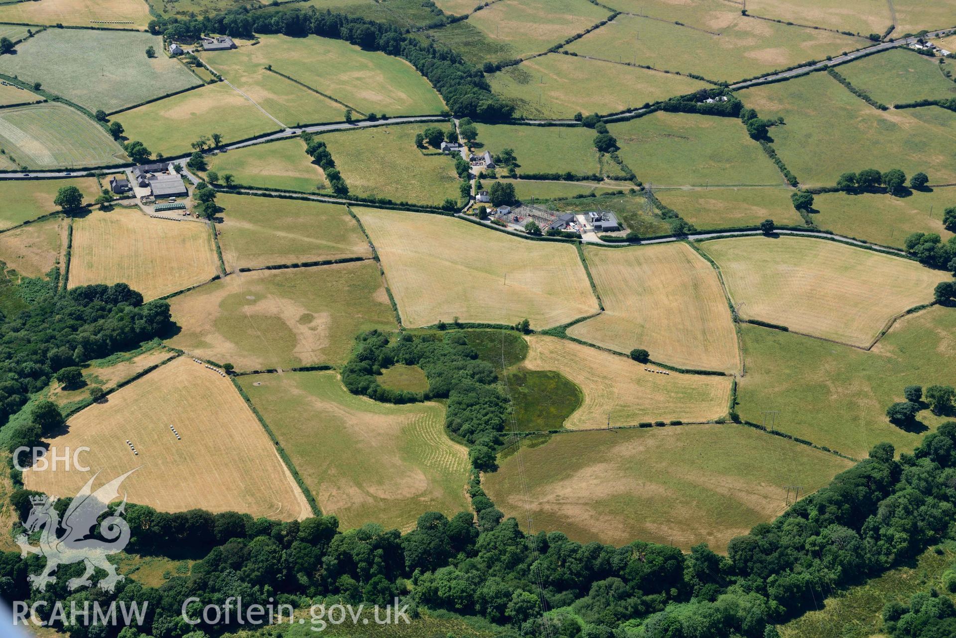 Aerial photograph: Bwlch y Ffordd Isa defended enclosure cropmark. Crown: CHERISH PROJECT 2018. Produced with EU funds through the Ireland Wales Co-operation Programme 2014-2020 (NGR SH402396)