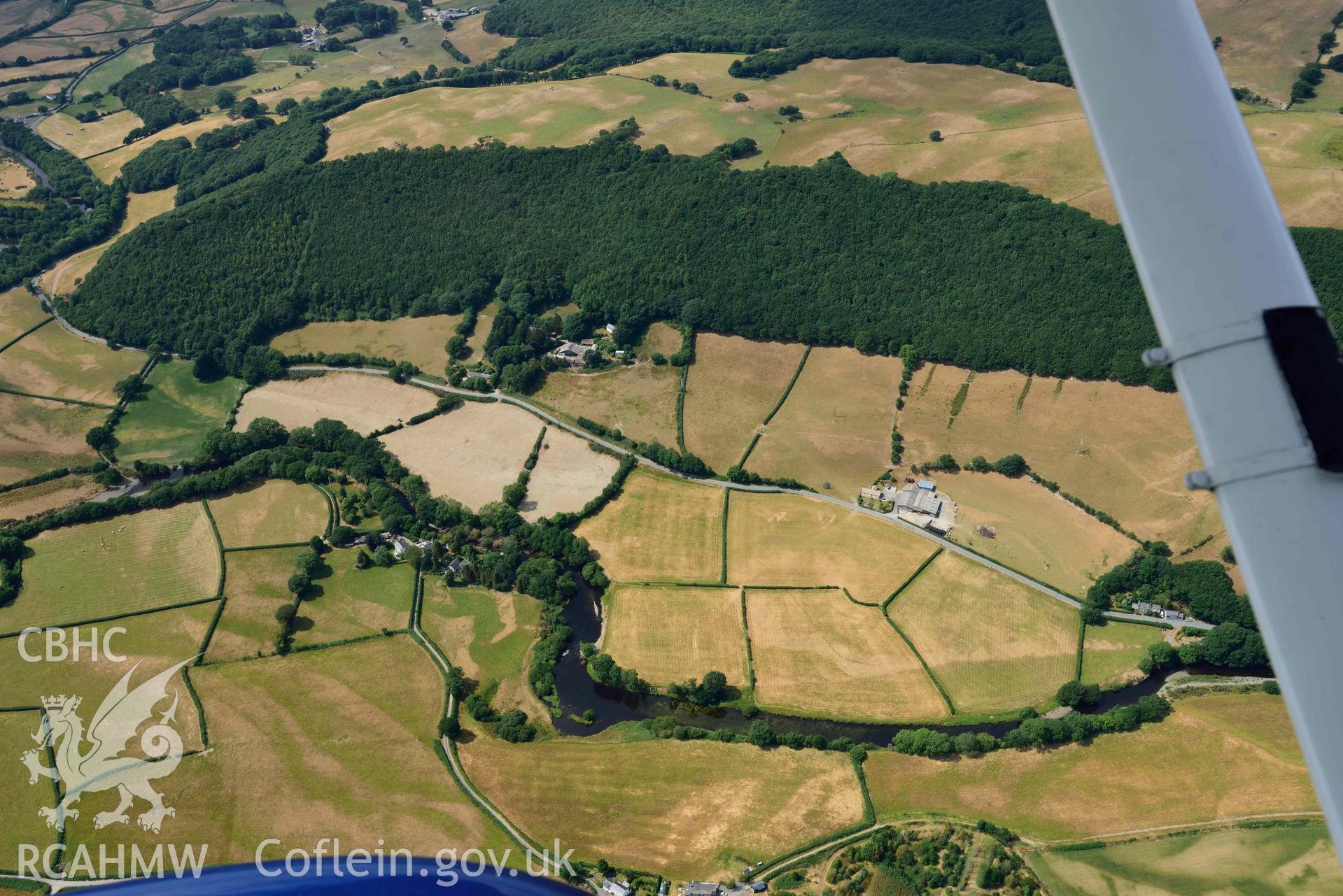 Aerial photograph: Dol-gamlyn, cropmarks of curving linear ditch of uncertain date. Crown: CHERISH PROJECT 2018. Produced with EU funds through the Ireland Wales Co-operation Programme 2014-2020 (NGR SN678789)