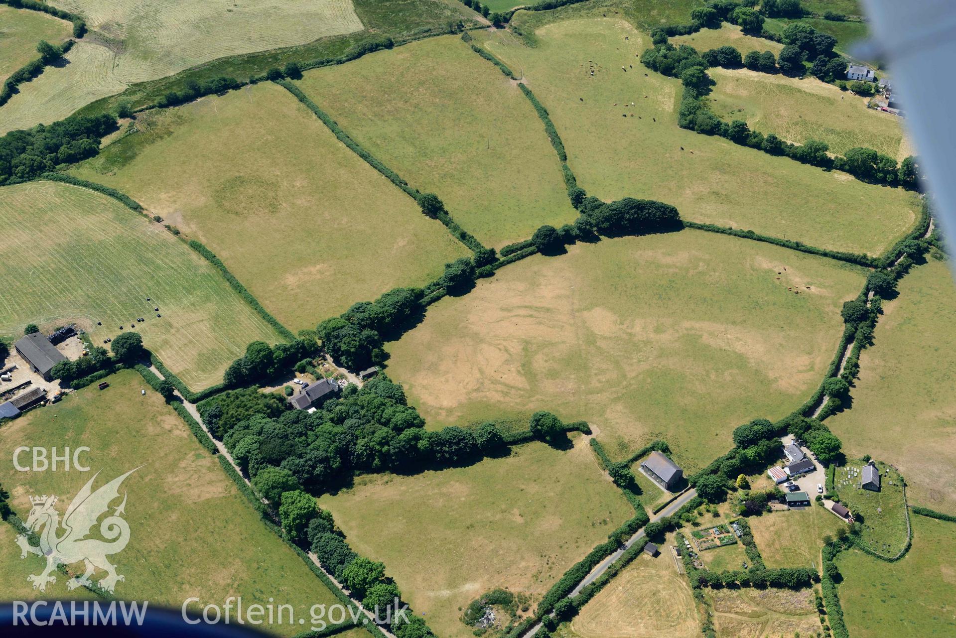 Aerial photograph: Capel Peniel, defended enclosure cropmark. Crown: CHERISH PROJECT 2018. Produced with EU funds through the Ireland Wales Co-operation Programme 2014-2020 (NGR SH287380)