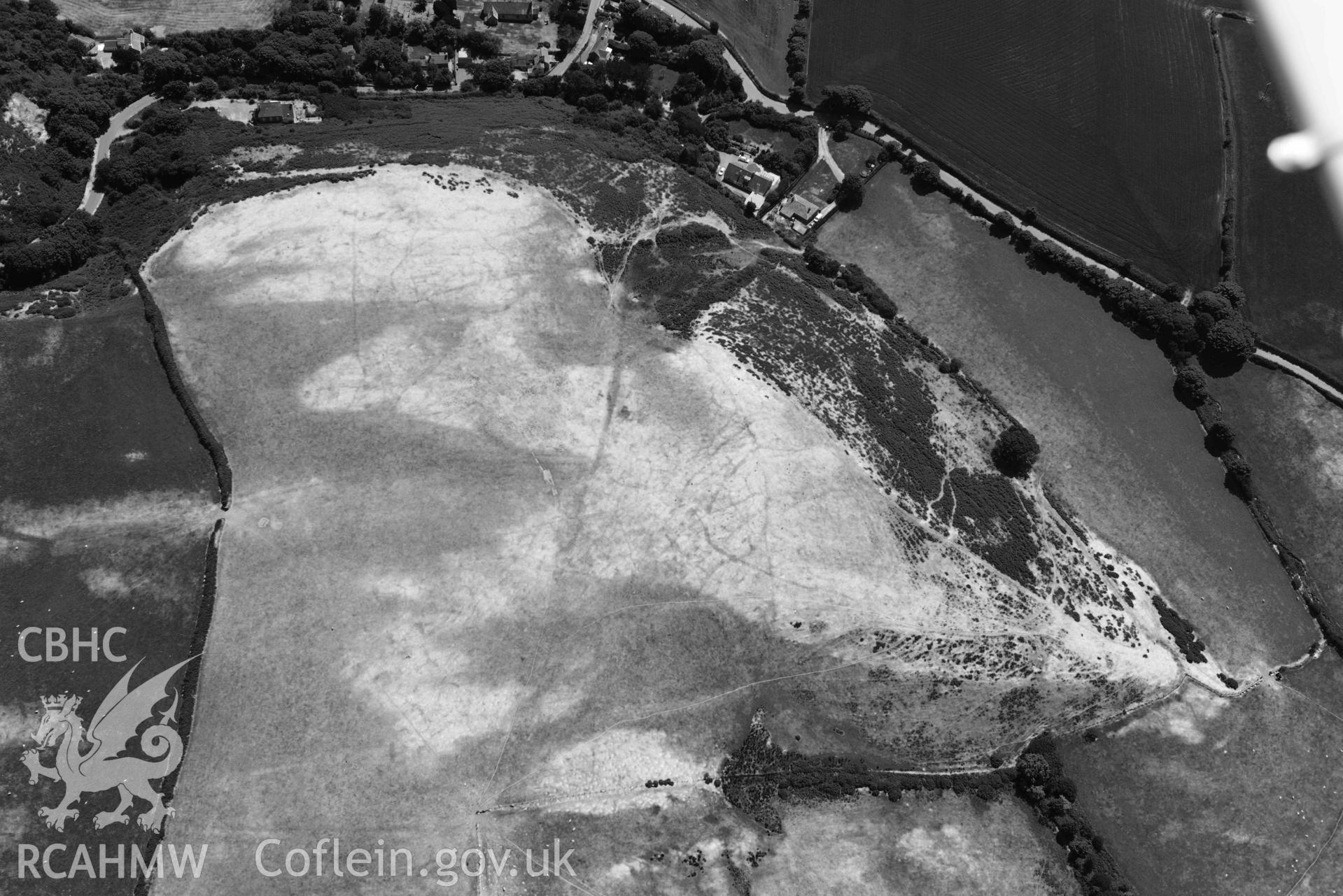 Aerial photograph: Llangian: cropmarks of early promontory enclosure, from north. Crown: CHERISH PROJECT 2018. Produced with EU funds through the Ireland Wales Co-operation Programme 2014-2020 (NGR SH294292)