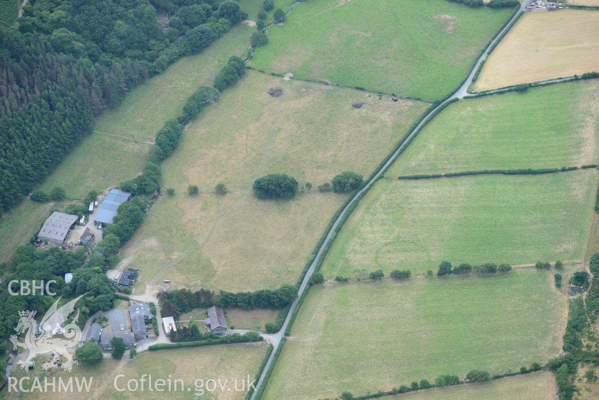 Aerial photograph: Allt-lwyd, Cwm Maethlon round barrow cropmarks. Crown: CHERISH PROJECT 2018. Produced with EU funds through the Ireland Wales Co-operation Programme 2014-2020 (NGR SH631985)