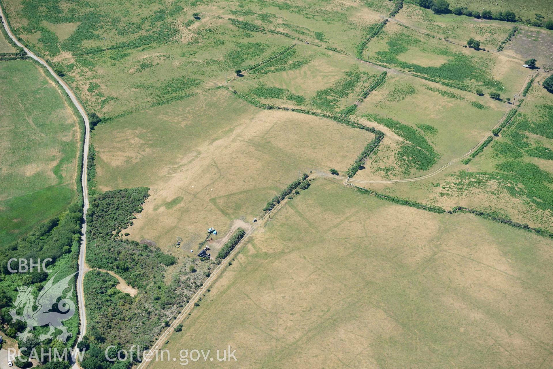 Aerial photograph: Traian, rectangular defended enclosure and field systems. Crown: CHERISH PROJECT 2018. Produced with EU funds through the Ireland Wales Co-operation Programme 2014-2020 (NGR SH329363)