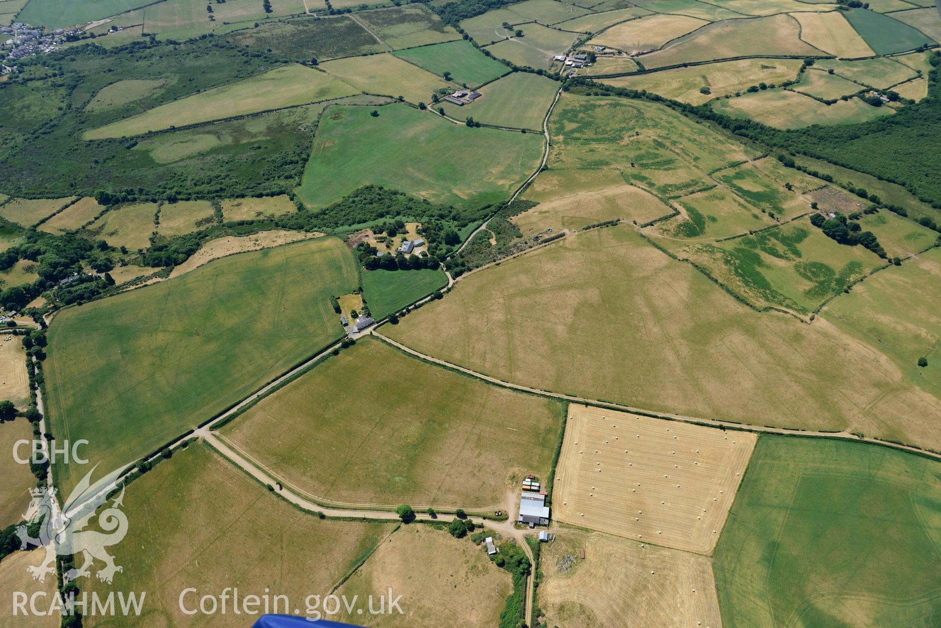 Aerial photograph: Bryn Bodfel ring ditches and field systems. Crown: CHERISH PROJECT 2018. Produced with EU funds through the Ireland Wales Co-operation Programme 2014-2020 (NGR SH335361)