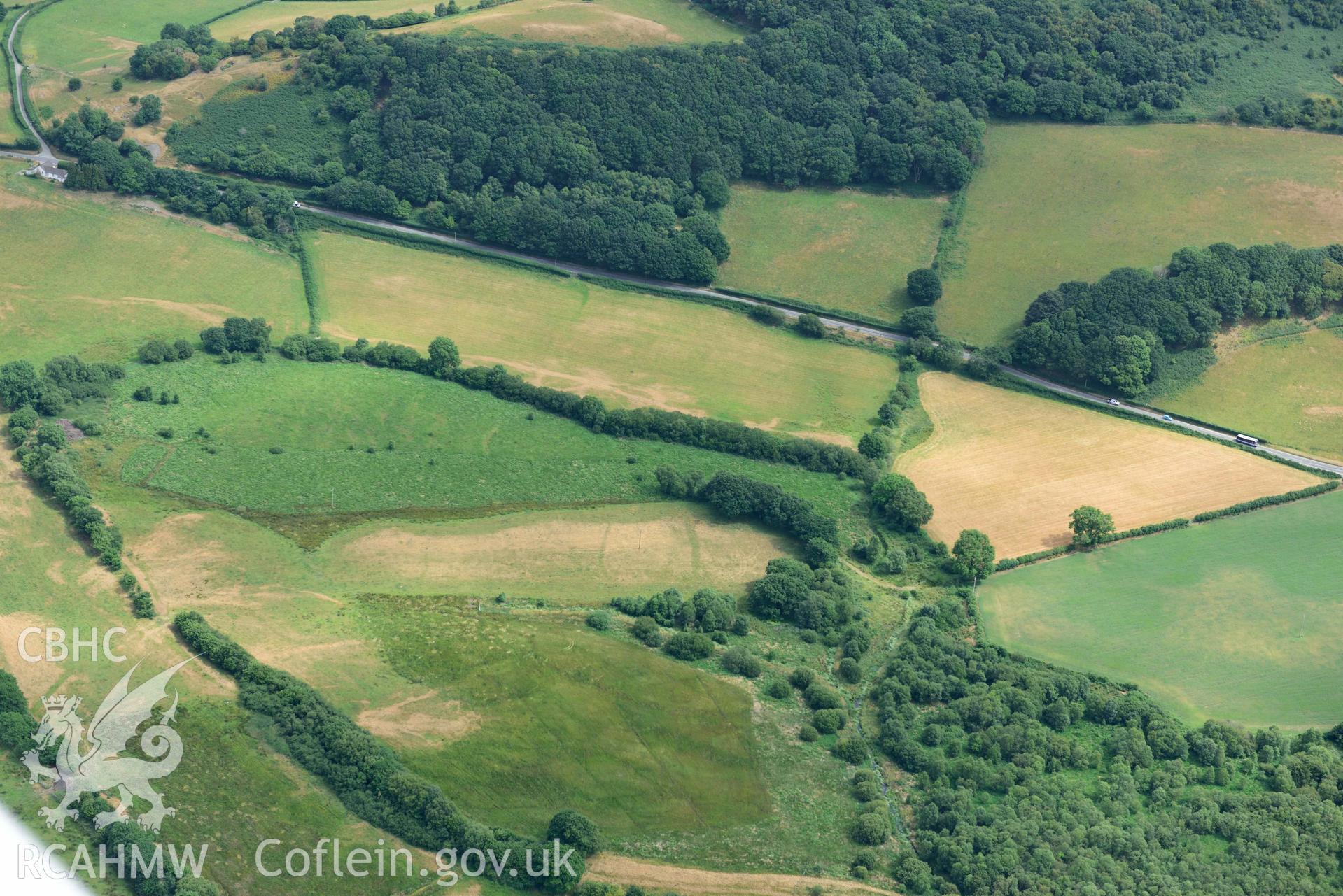 Aerial photograph: Pont Fflur to Old Abbey Farm; complex of drainage and trackway parchmarks; cross ditches on ridge. Crown: CHERISH PROJECT 2018. Produced with EU funds through the Ireland Wales Co-operation Programme 2014-2020 (NGR SN710644)