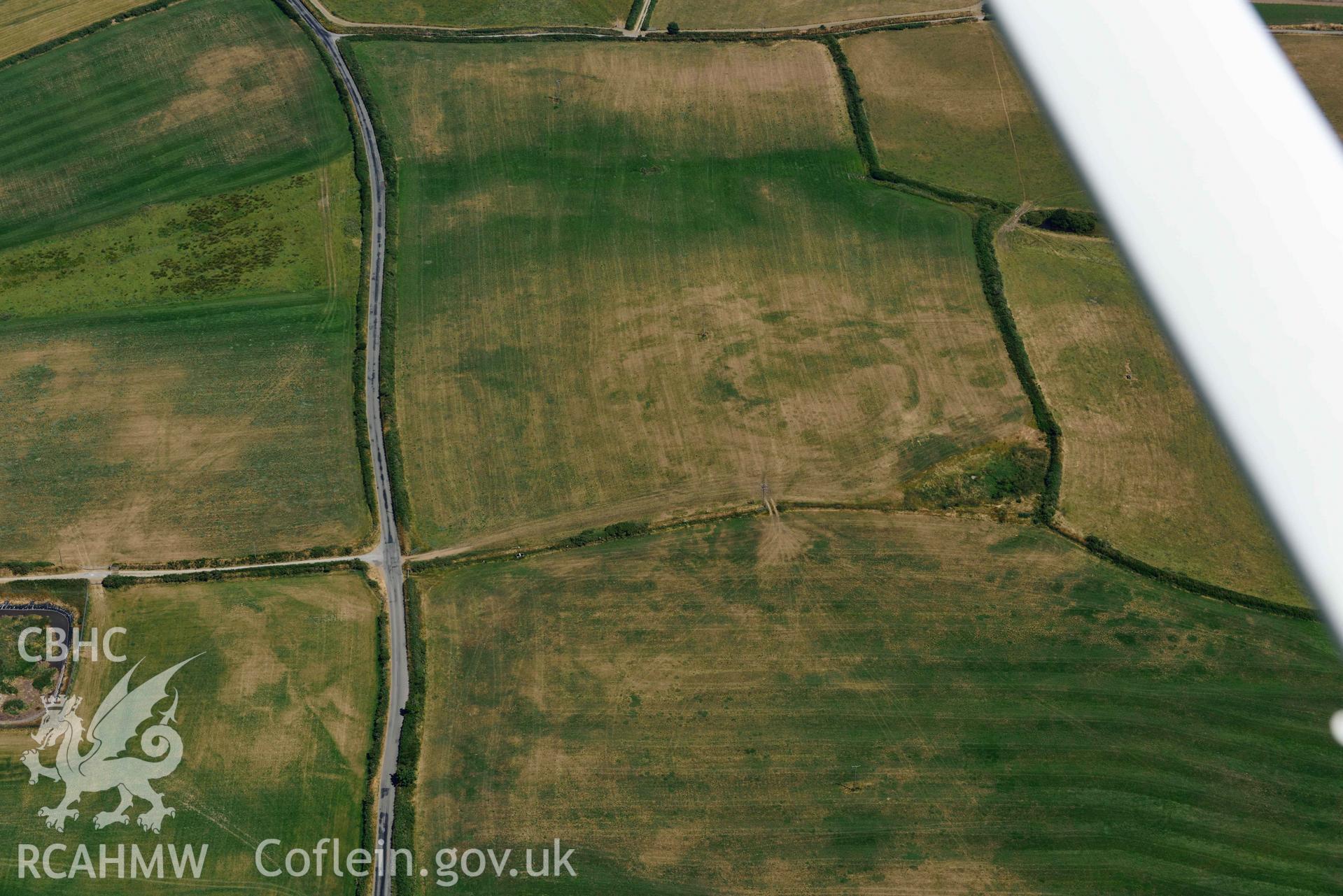 Aerial photograph: Bryniau or Bryn Rhydd cropmark enclosure. Crown: CHERISH PROJECT 2018. Produced with EU funds through the Ireland Wales Co-operation Programme 2014-2020 (NGR SH265387)