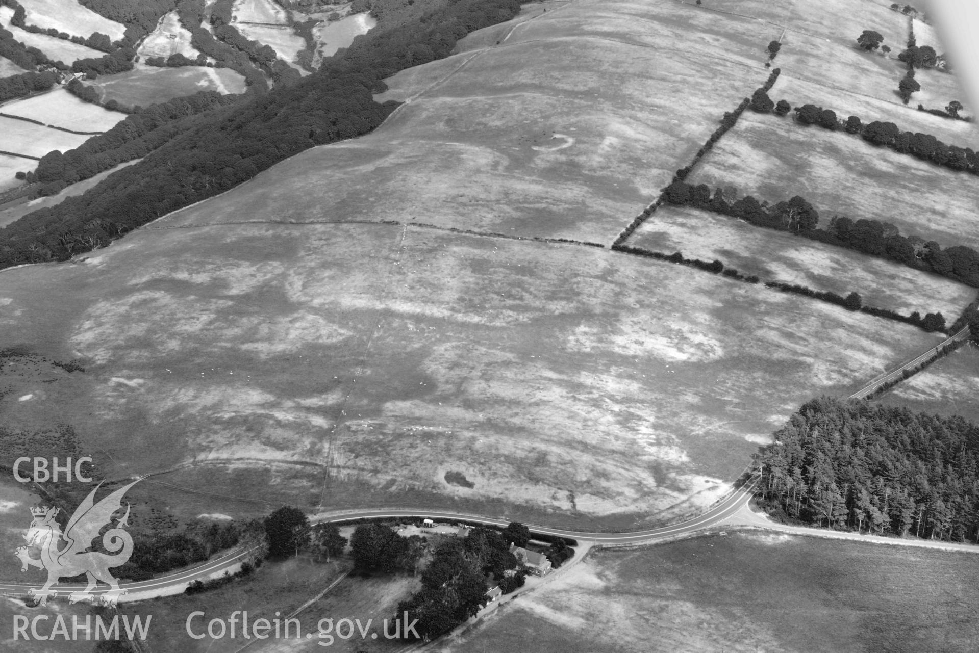 Aerial photograph: Bwlch-y-Crwys round barrow, with parchmarks. Crown: CHERISH PROJECT 2018. Produced with EU funds through the Ireland Wales Co-operation Programme 2014-2020 (NGR SN710776)