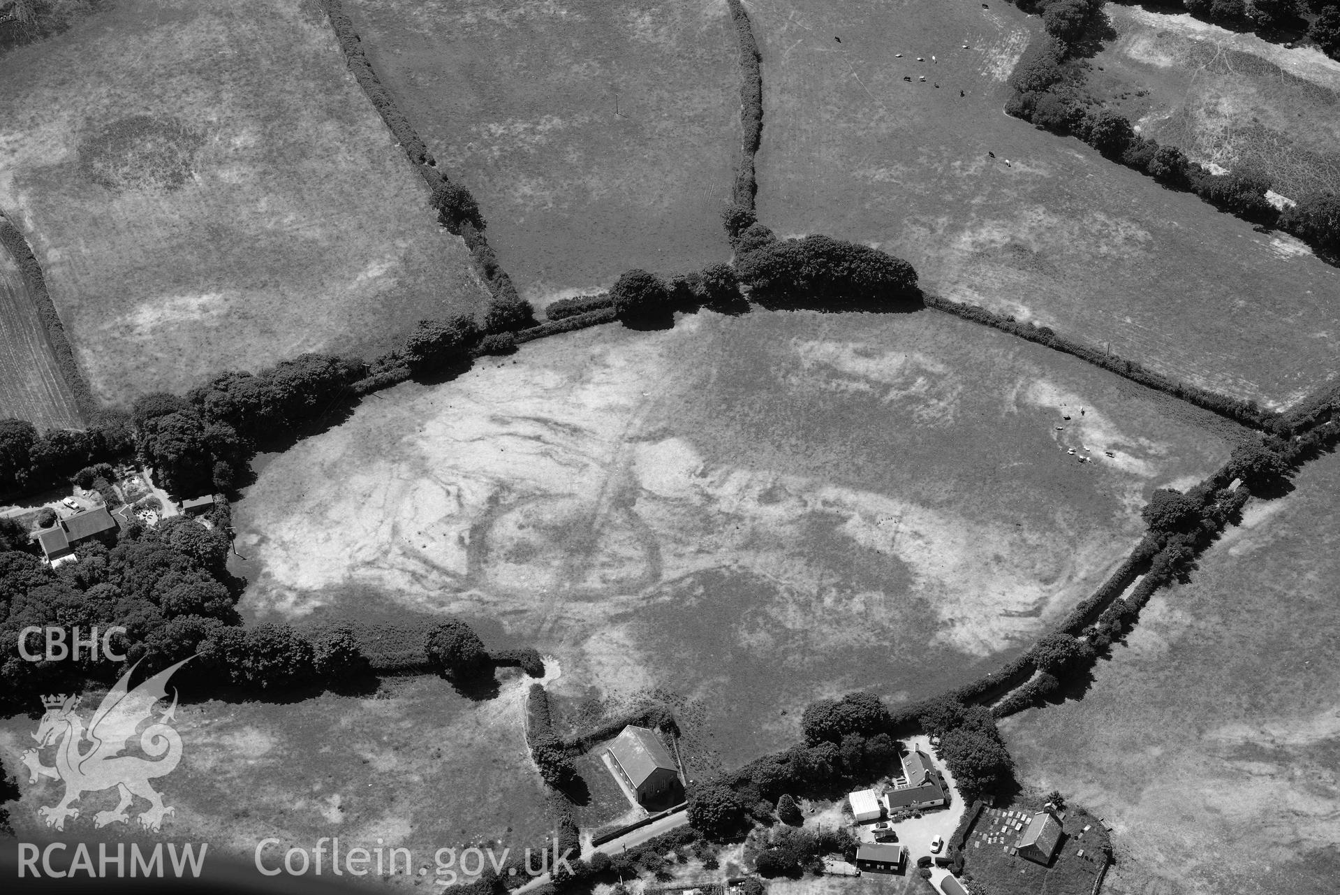 Aerial photograph: Capel Peniel, defended enclosure cropmark. Crown: CHERISH PROJECT 2018. Produced with EU funds through the Ireland Wales Co-operation Programme 2014-2020 (NGR SH287380)