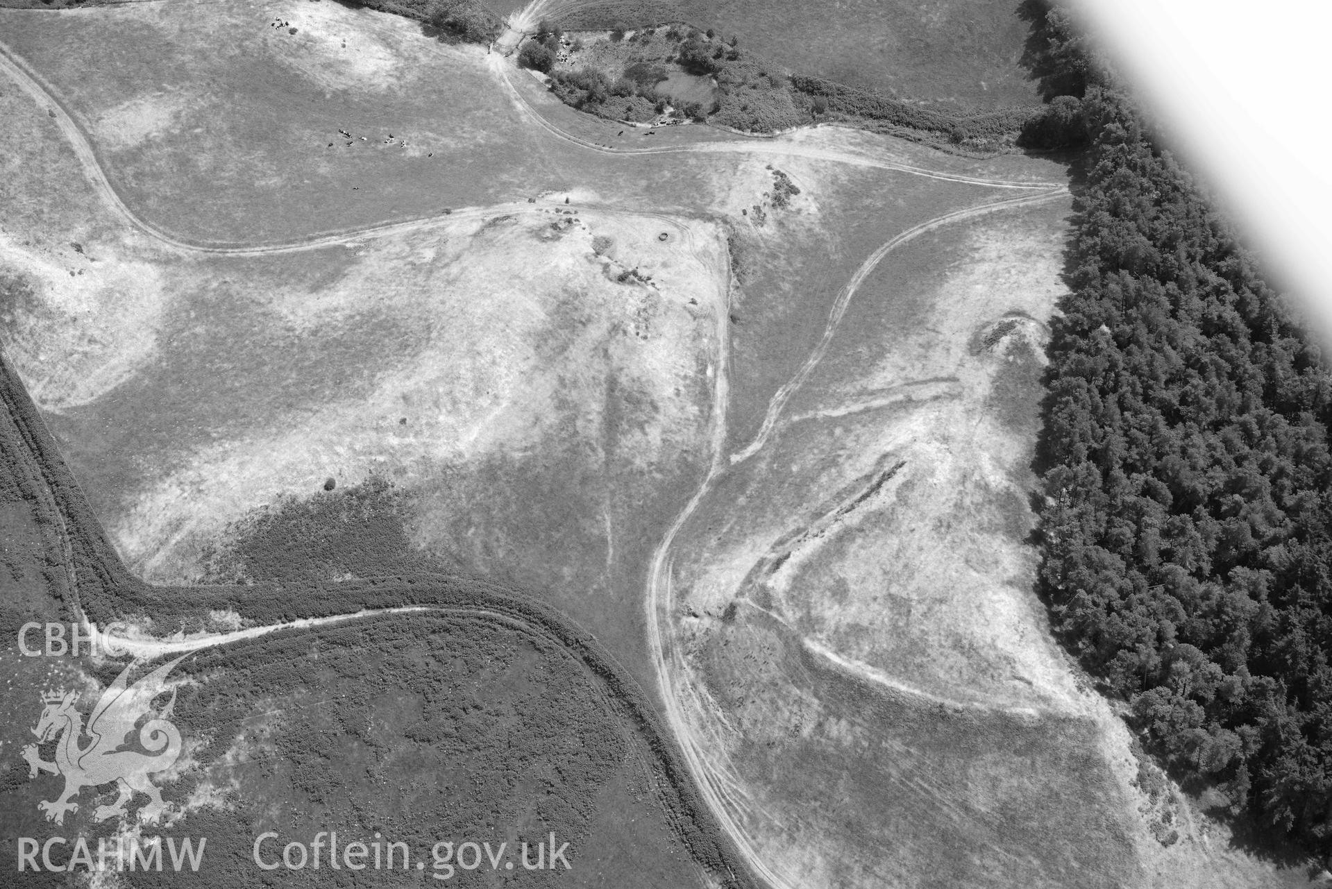 Aerial photograph: Cnwc y Bugail hillfort, with parchmarks. Crown: CHERISH PROJECT 2018. Produced with EU funds through the Ireland Wales Co-operation Programme 2014-2020 (NGR SN687740)