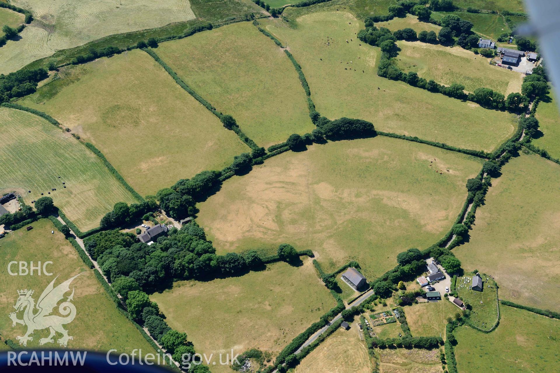 Aerial photograph: Capel Peniel, defended enclosure cropmark. Crown: CHERISH PROJECT 2018. Produced with EU funds through the Ireland Wales Co-operation Programme 2014-2020 (NGR SH287380)