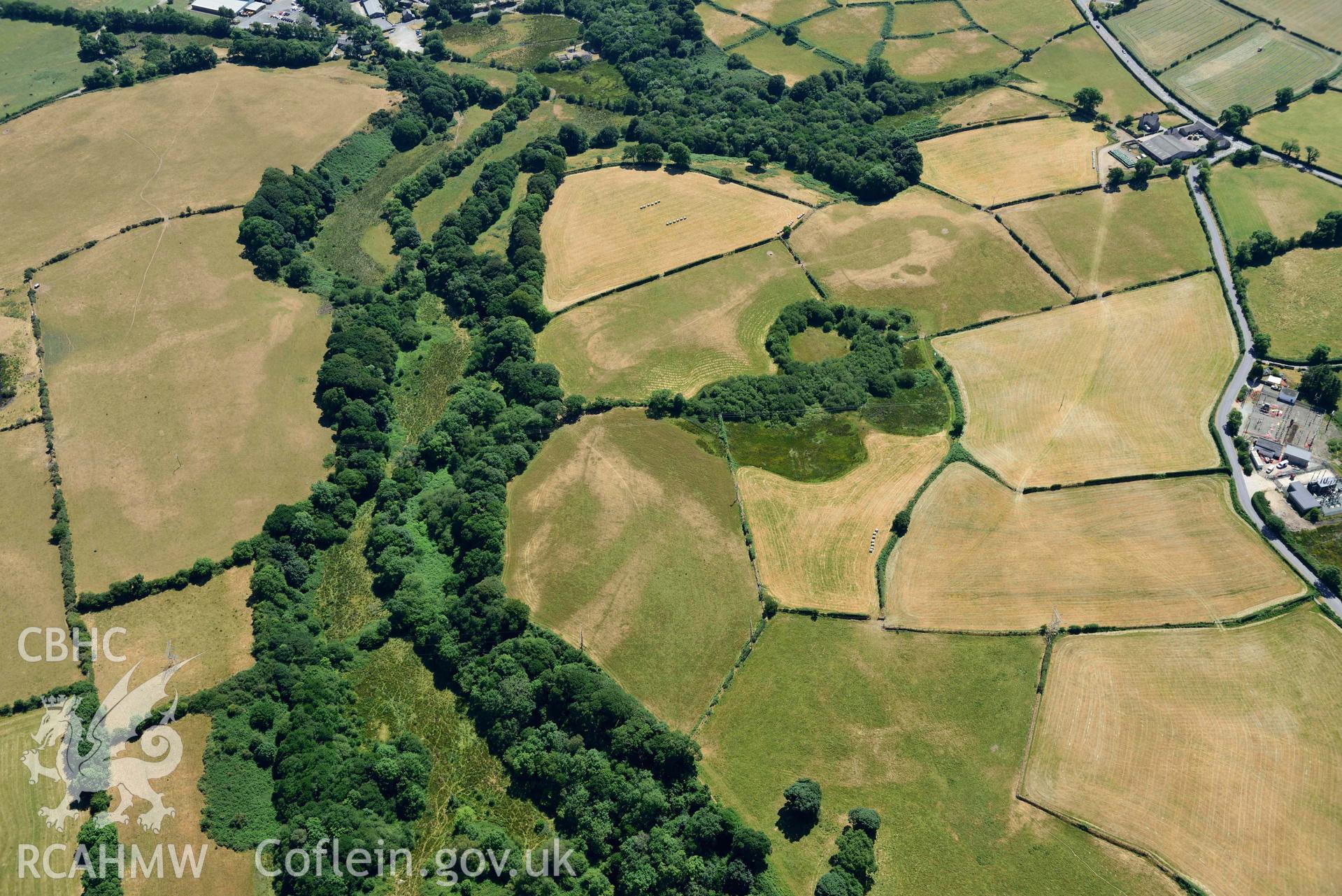 Aerial photograph: Bwlch y Ffordd Isa defended enclosure cropmark. Crown: CHERISH PROJECT 2018. Produced with EU funds through the Ireland Wales Co-operation Programme 2014-2020 (NGR SH402396)