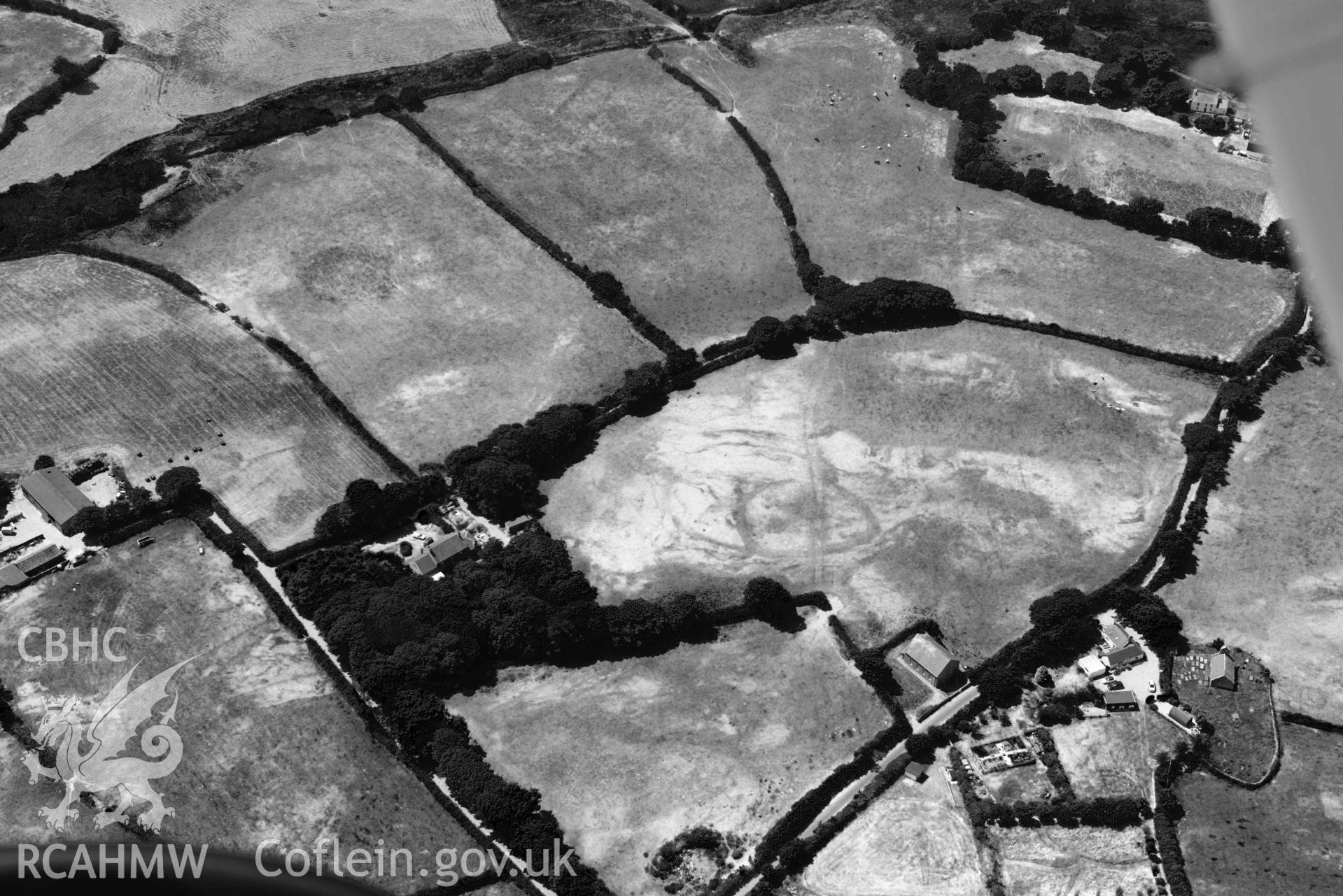 Aerial photograph: Capel Peniel, defended enclosure cropmark. Crown: CHERISH PROJECT 2018. Produced with EU funds through the Ireland Wales Co-operation Programme 2014-2020 (NGR SH287380)