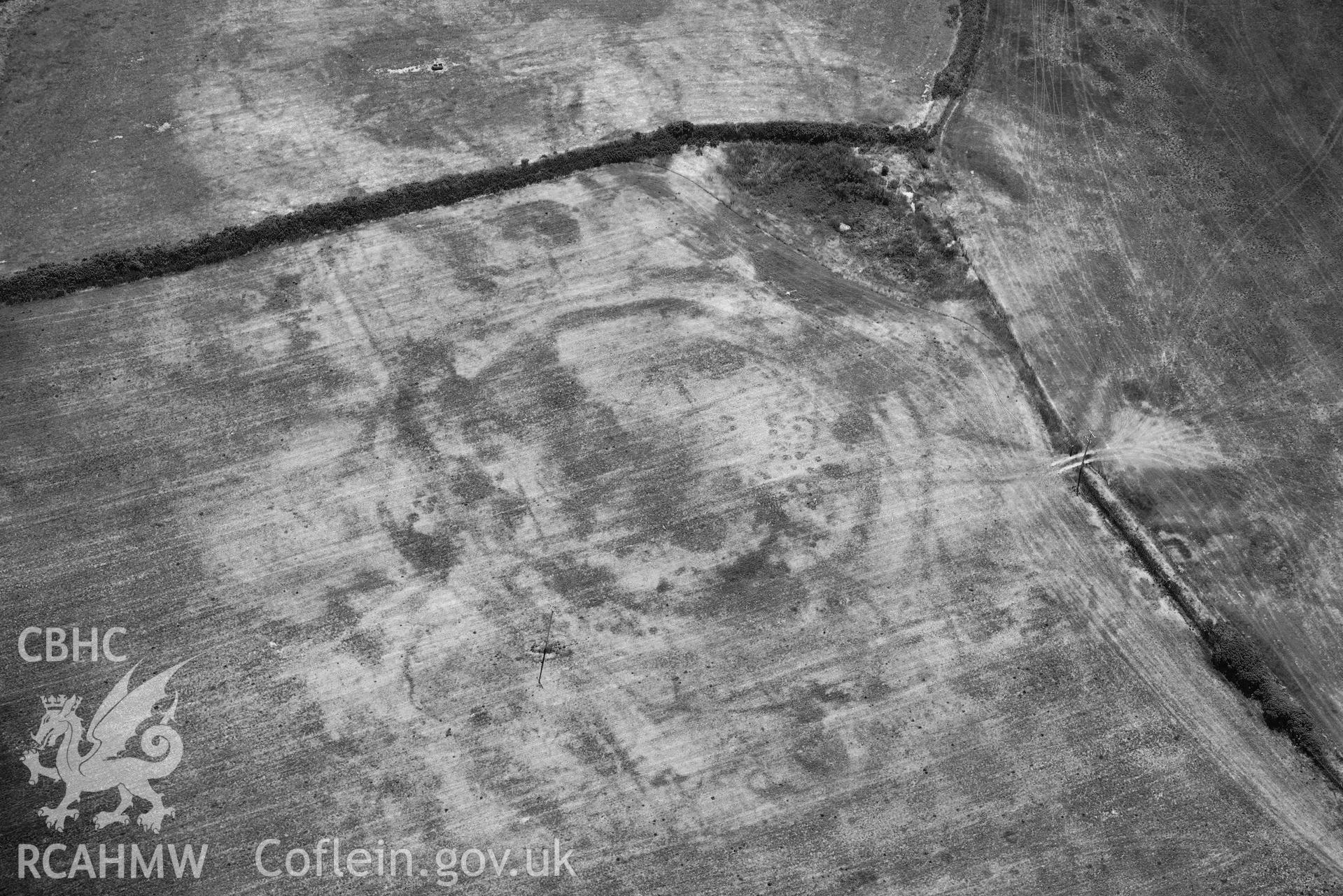 Aerial photograph: Bryniau or Bryn Rhydd cropmark enclosure. Crown: CHERISH PROJECT 2018. Produced with EU funds through the Ireland Wales Co-operation Programme 2014-2020 (NGR SH265387)