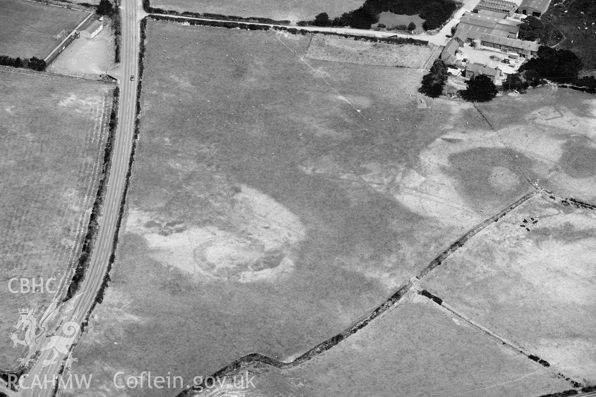 Aerial photograph: Bodtacho Ddu, prehistoric defended enclosure and cropmarks. Crown: CHERISH PROJECT 2018. Produced with EU funds through the Ireland Wales Co-operation Programme 2014-2020 (NGR SH299394)