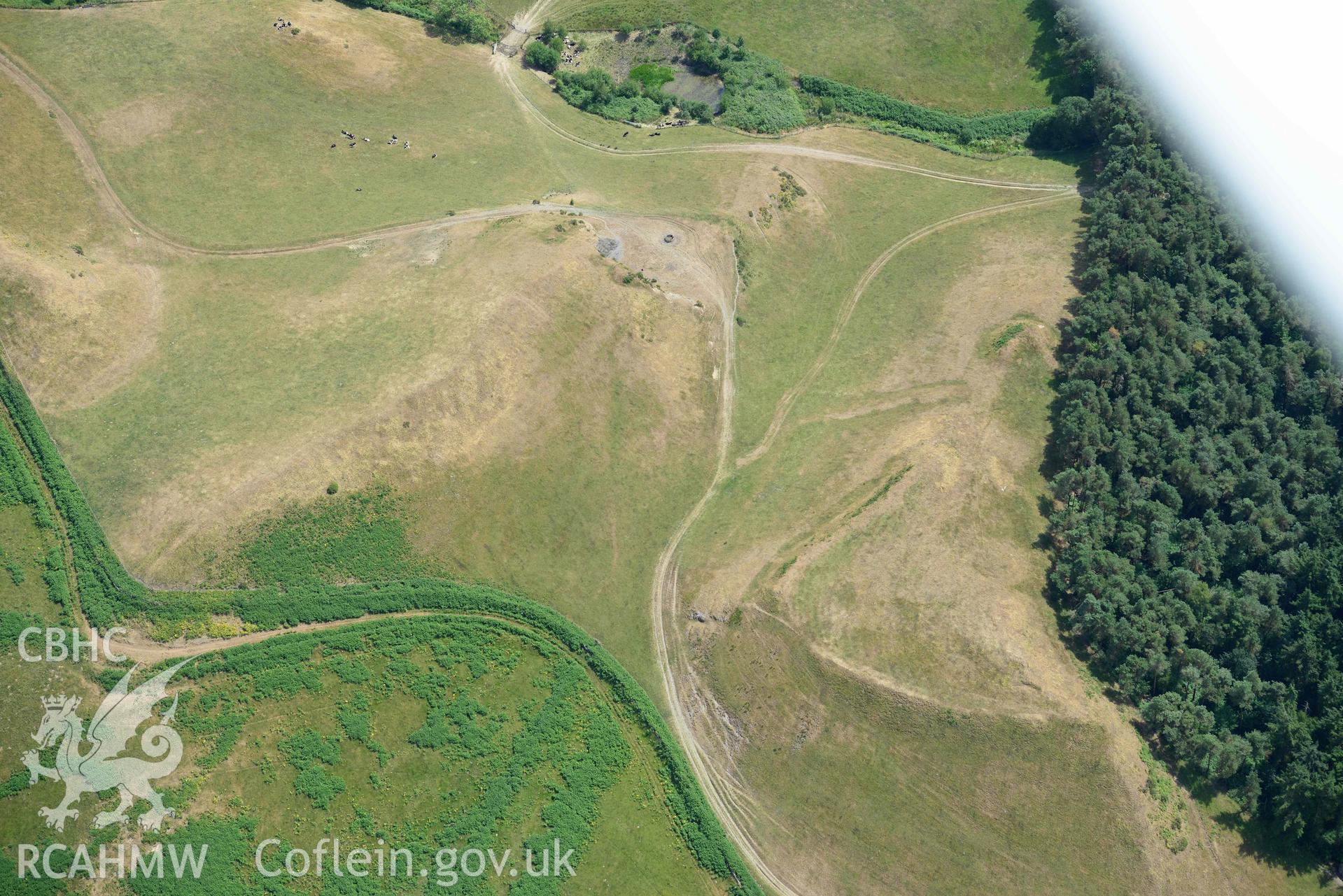 Aerial photograph: Cnwc y Bugail hillfort, with parchmarks. Crown: CHERISH PROJECT 2018. Produced with EU funds through the Ireland Wales Co-operation Programme 2014-2020 (NGR SN687740)