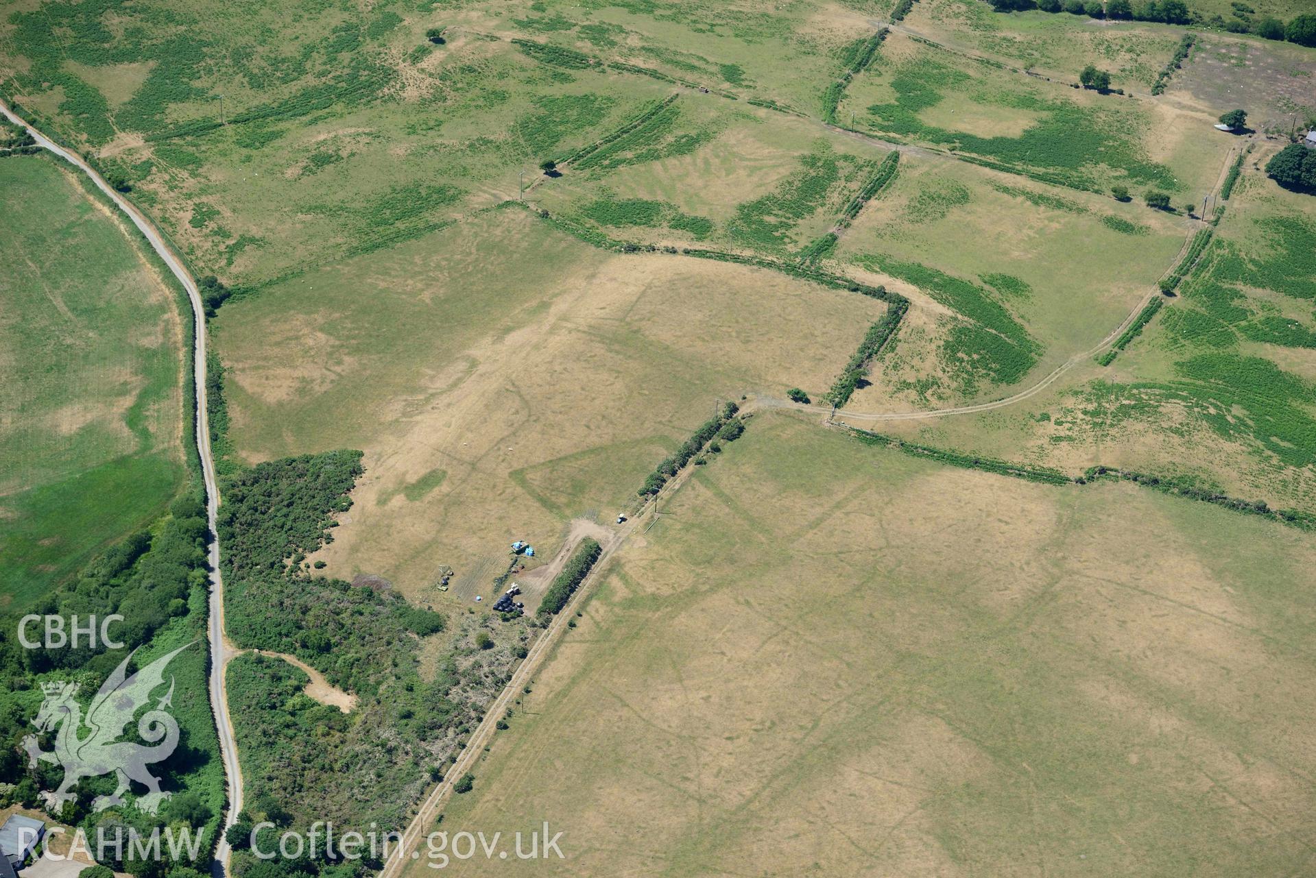 Aerial photograph: Traian, rectangular defended enclosure and field systems. Crown: CHERISH PROJECT 2018. Produced with EU funds through the Ireland Wales Co-operation Programme 2014-2020 (NGR SH329363)