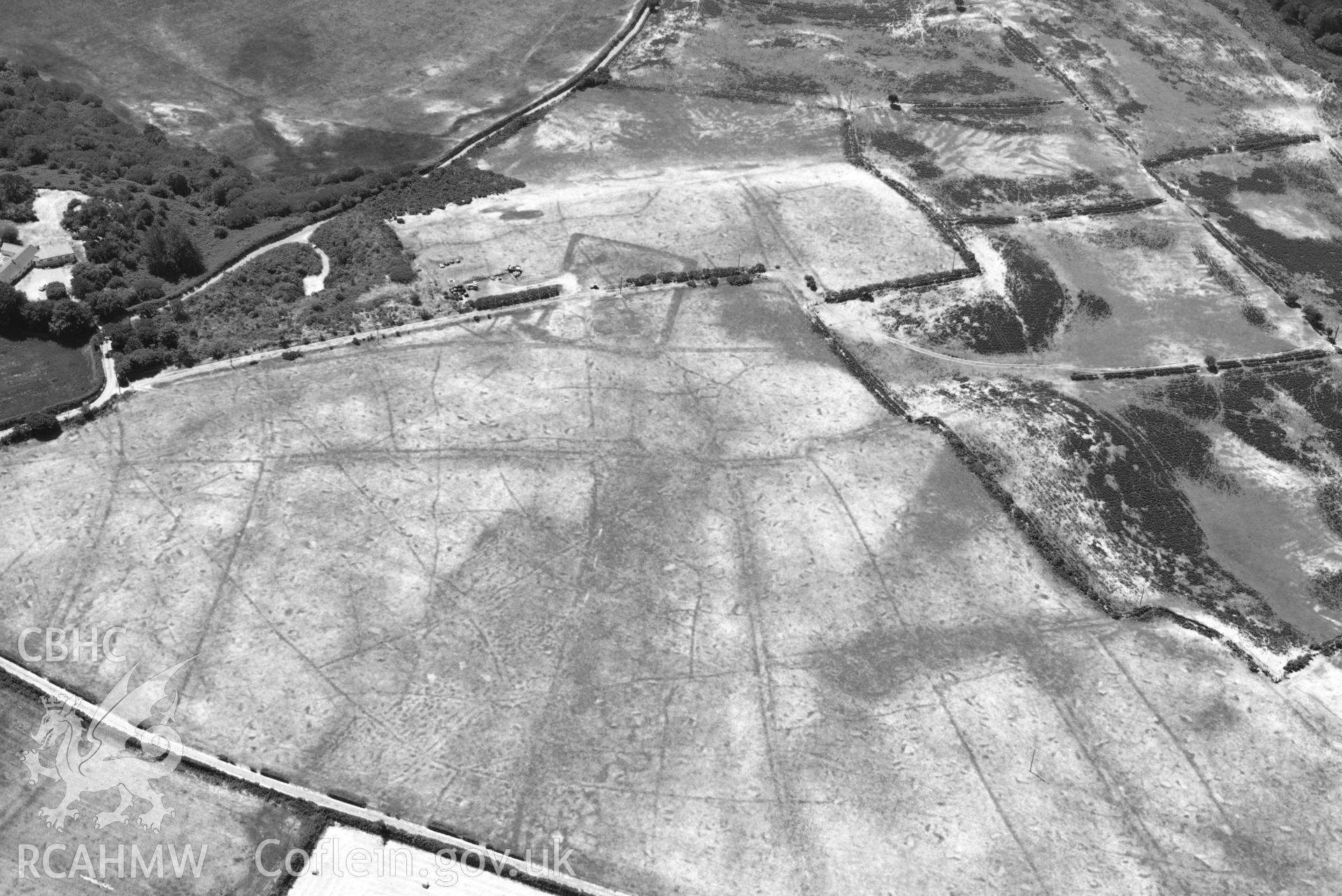 Aerial photograph: Traian, rectangular defended enclosure and field systems. Crown: CHERISH PROJECT 2018. Produced with EU funds through the Ireland Wales Co-operation Programme 2014-2020 (NGR SH329363)