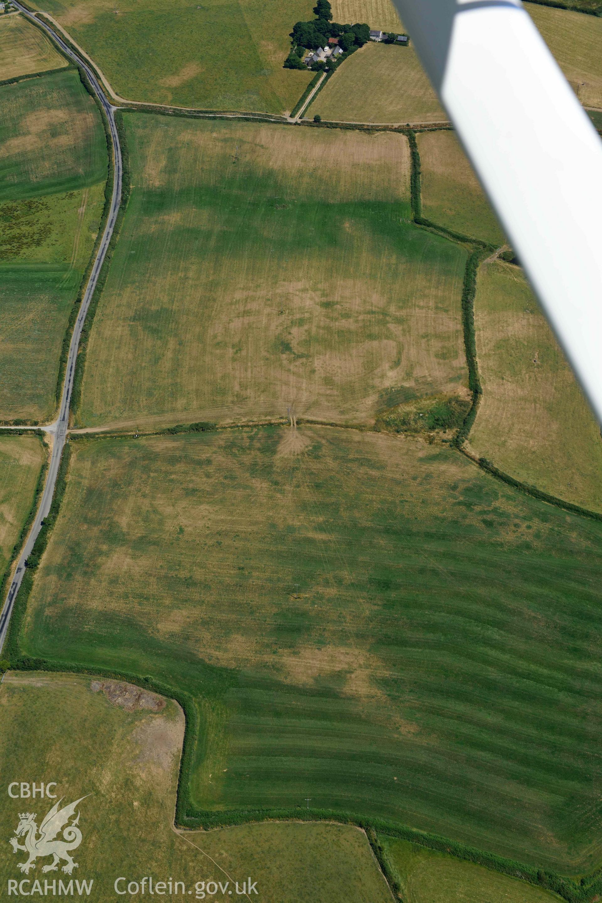 Aerial photograph: Bryniau or Bryn Rhydd cropmark enclosure. Crown: CHERISH PROJECT 2018. Produced with EU funds through the Ireland Wales Co-operation Programme 2014-2020 (NGR SH265387)