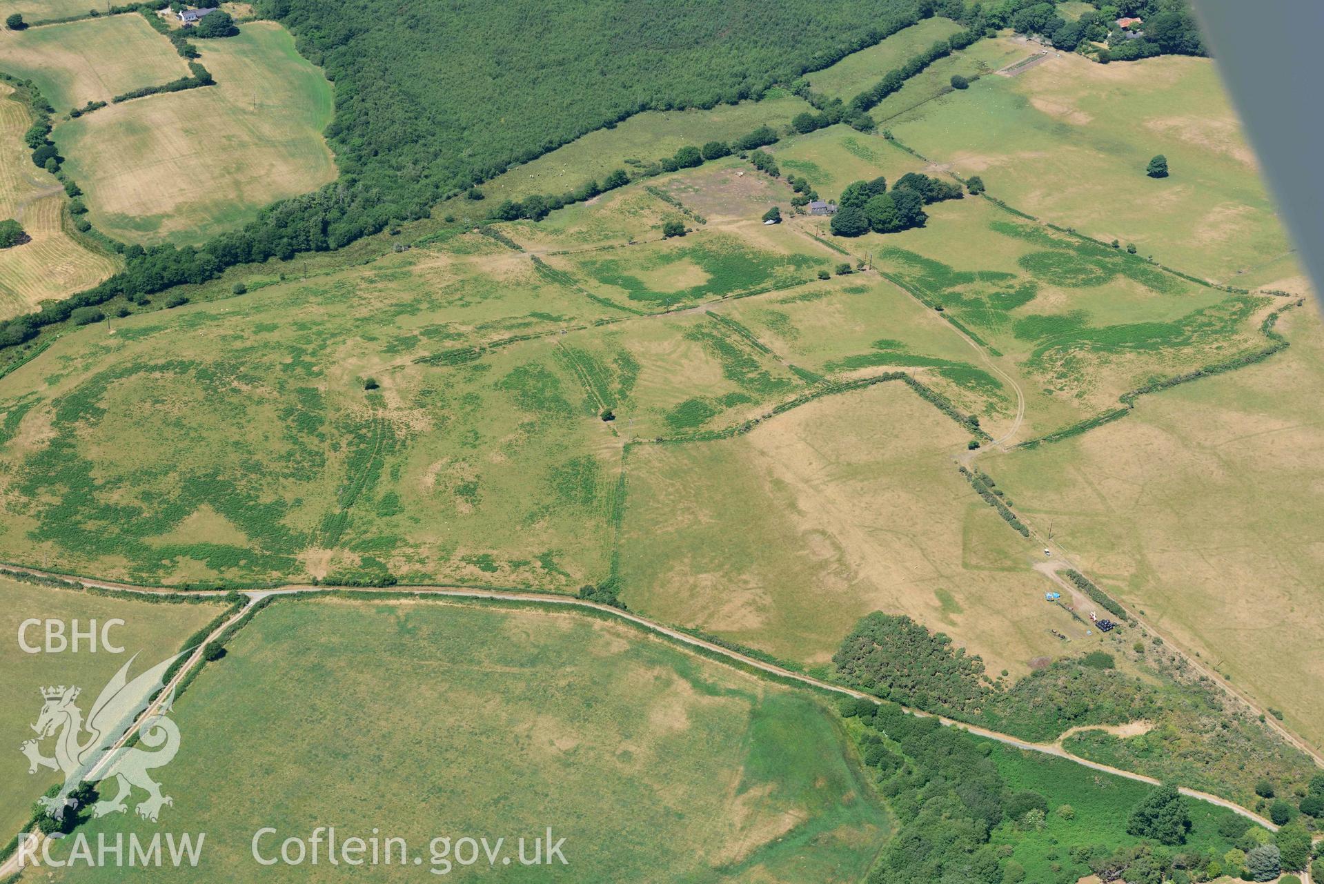 Aerial photograph: Bryn Bodfel ring ditches and field systems, view from south. Crown: CHERISH PROJECT 2018. Produced with EU funds through the Ireland Wales Co-operation Programme 2014-2020 (NGR SH335361)