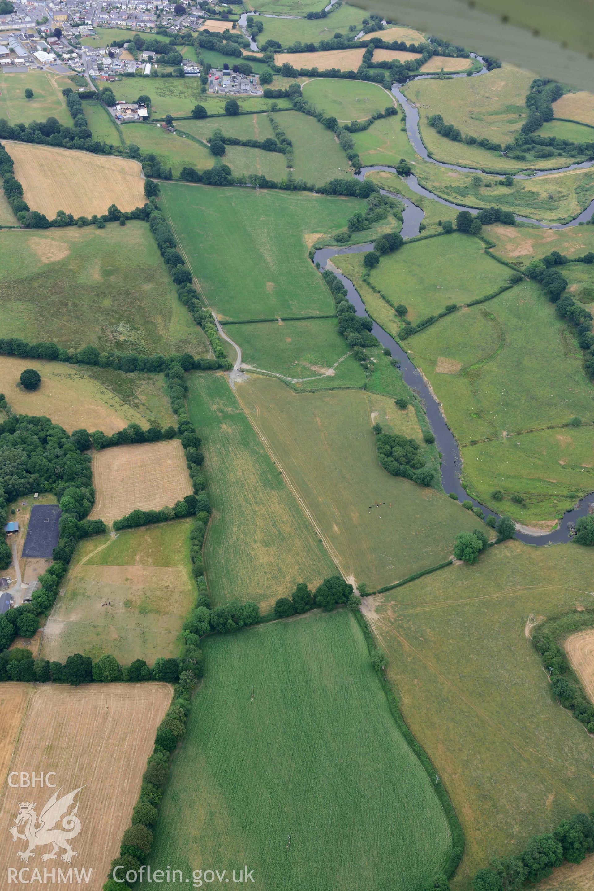 Aerial photograph: Lampeter Common Roman road, view from west with parchmarks. Crown: CHERISH PROJECT 2018. Produced with EU funds through the Ireland Wales Co-operation Programme 2014-2020 (NGR SN567471)