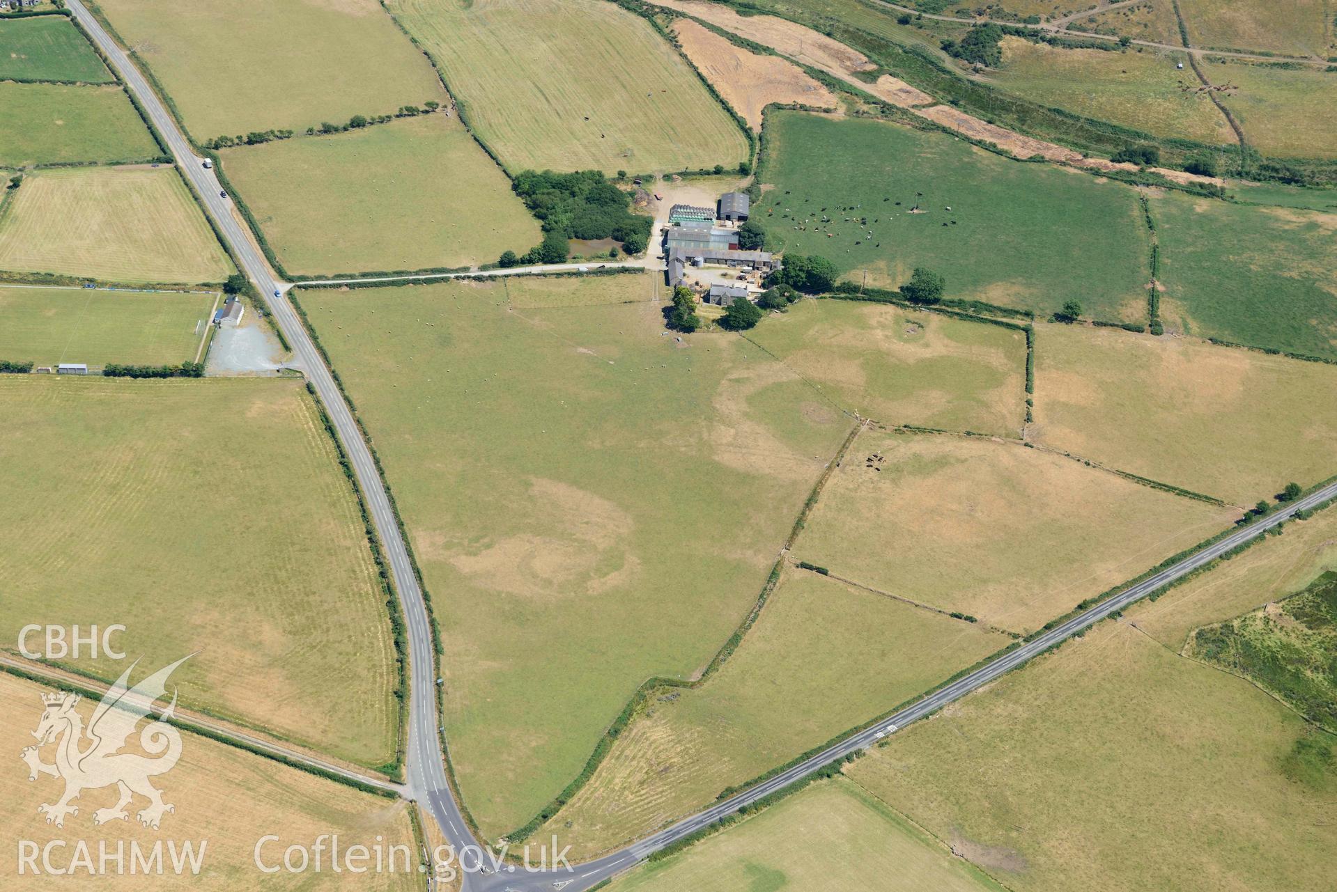 Aerial photograph: Bodtacho Ddu, prehistoric defended enclosure and cropmarks. Crown: CHERISH PROJECT 2018. Produced with EU funds through the Ireland Wales Co-operation Programme 2014-2020 (NGR SH299394)