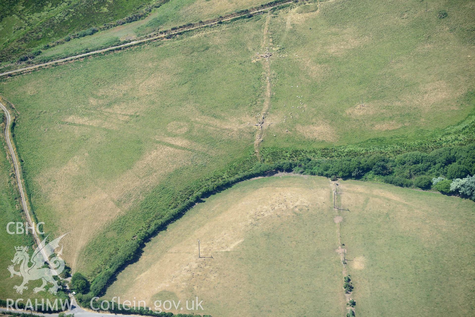 Aerial photograph: Llawr-Dref cropmark complex and barrows. Crown: CHERISH PROJECT 2018. Produced with EU funds through the Ireland Wales Co-operation Programme 2014-2020 (NGR SH291285)