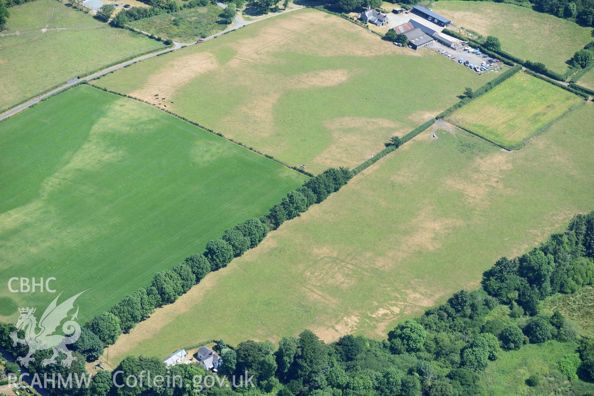 Aerial photograph: Pont Rhyd-hir defended enclosure cropmark. Crown: CHERISH PROJECT 2018. Produced with EU funds through the Ireland Wales Co-operation Programme 2014-2020 (NGR SH346355)