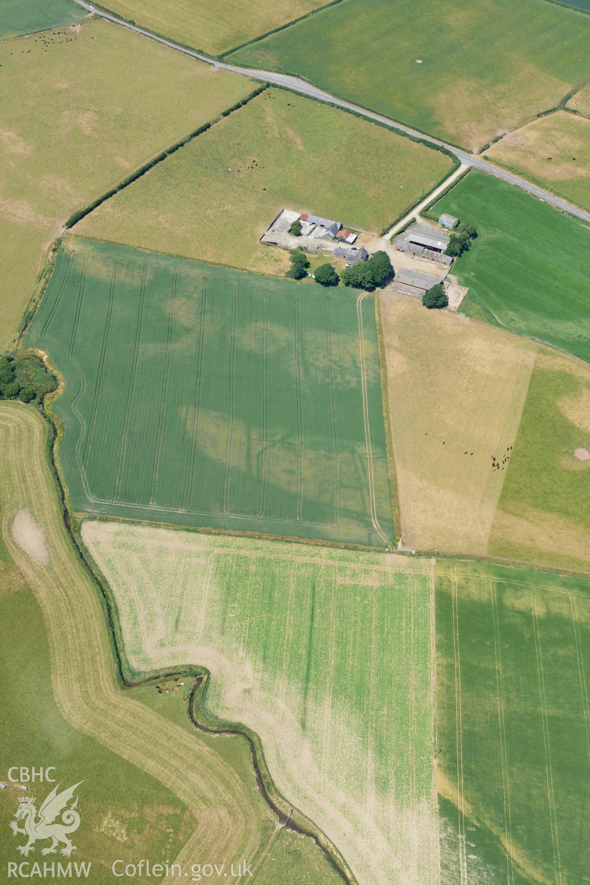 Aerial photograph: Botwnnog village, view from south-west with cropmarks. Crown: CHERISH PROJECT 2018. Produced with EU funds through the Ireland Wales Co-operation Programme 2014-2020 (NGR SH260310)