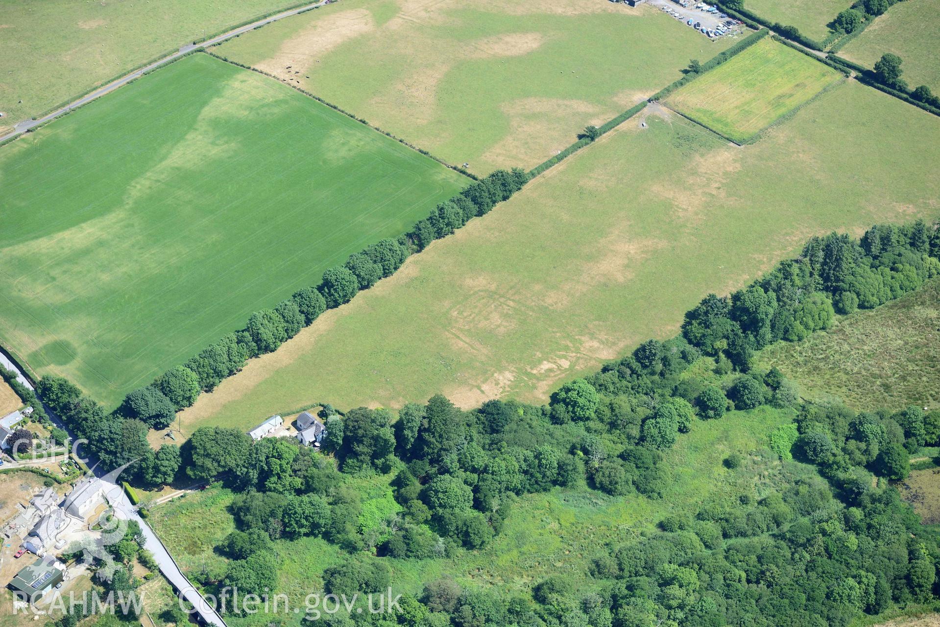 Aerial photograph: Pont Rhyd-hir defended enclosure cropmark. Crown: CHERISH PROJECT 2018. Produced with EU funds through the Ireland Wales Co-operation Programme 2014-2020 (NGR SH346355)