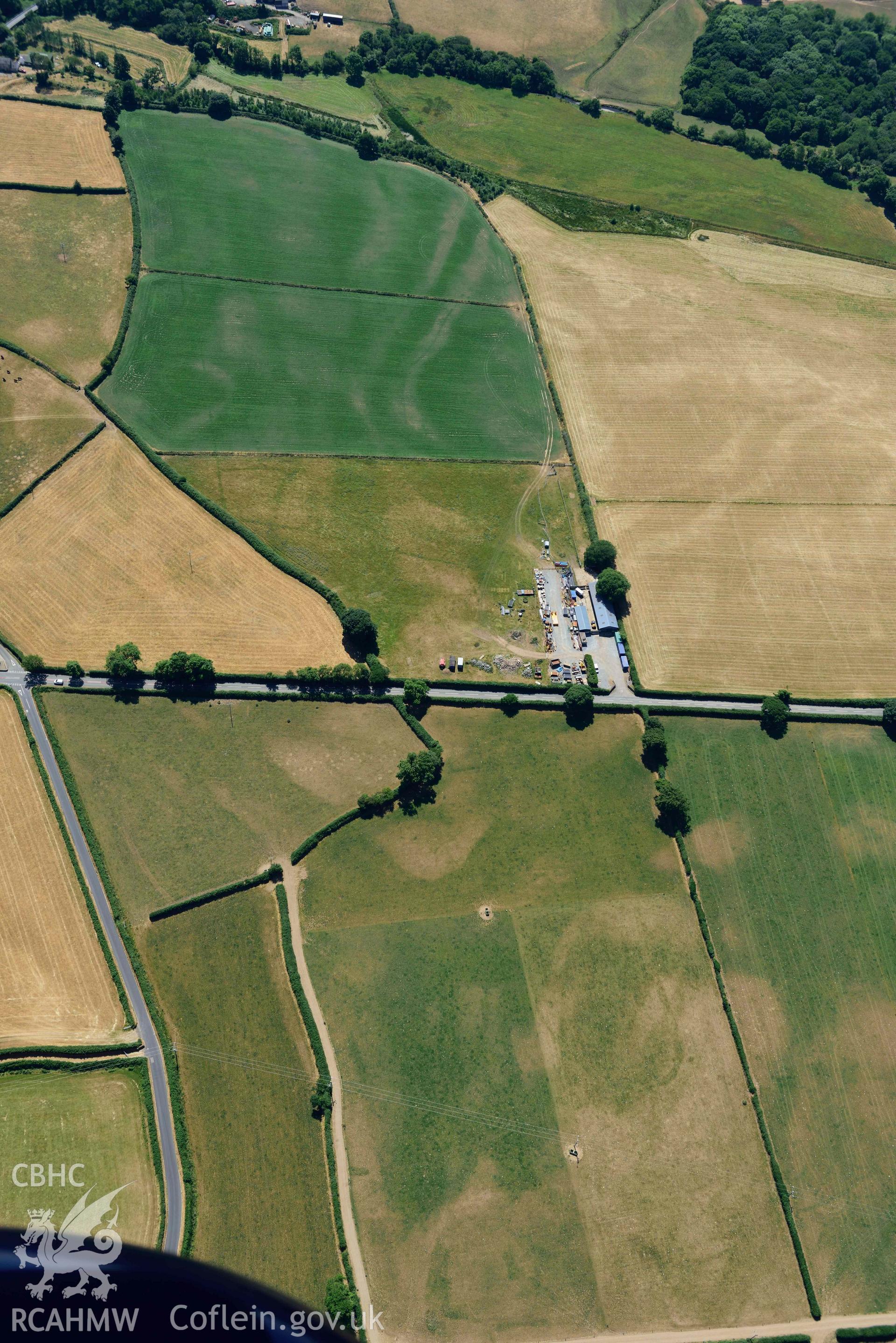 Aerial photograph: Enclosures and early field system cropmarks, Cefail y Bont, Efailnewydd. Crown: CHERISH PROJECT 2018. Produced with EU funds through the Ireland Wales Co-operation Programme 2014-2020 (NGR SH347365)