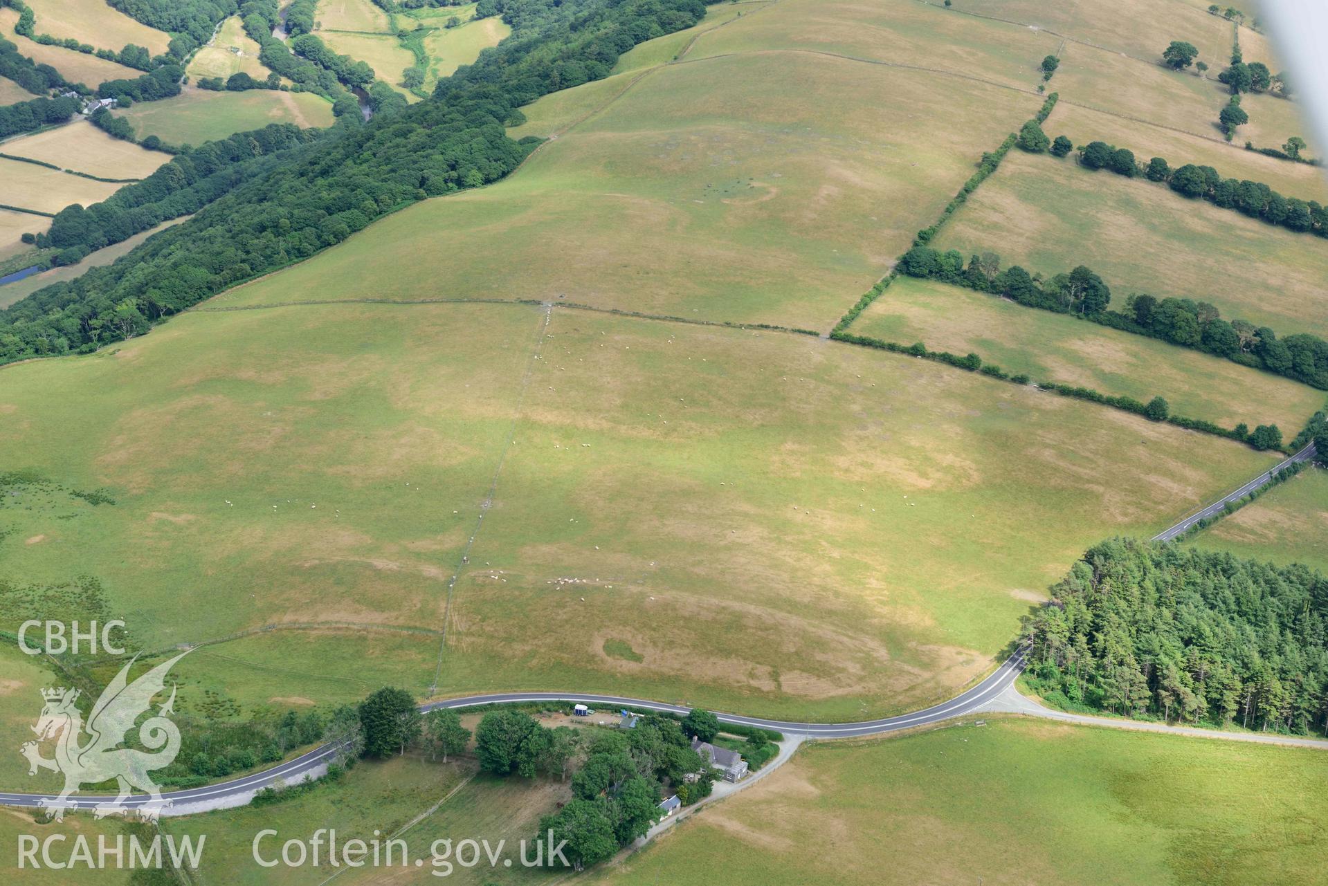 Aerial photograph: Bwlch-y-Crwys round barrow, with parchmarks. Crown: CHERISH PROJECT 2018. Produced with EU funds through the Ireland Wales Co-operation Programme 2014-2020 (NGR SN710776)