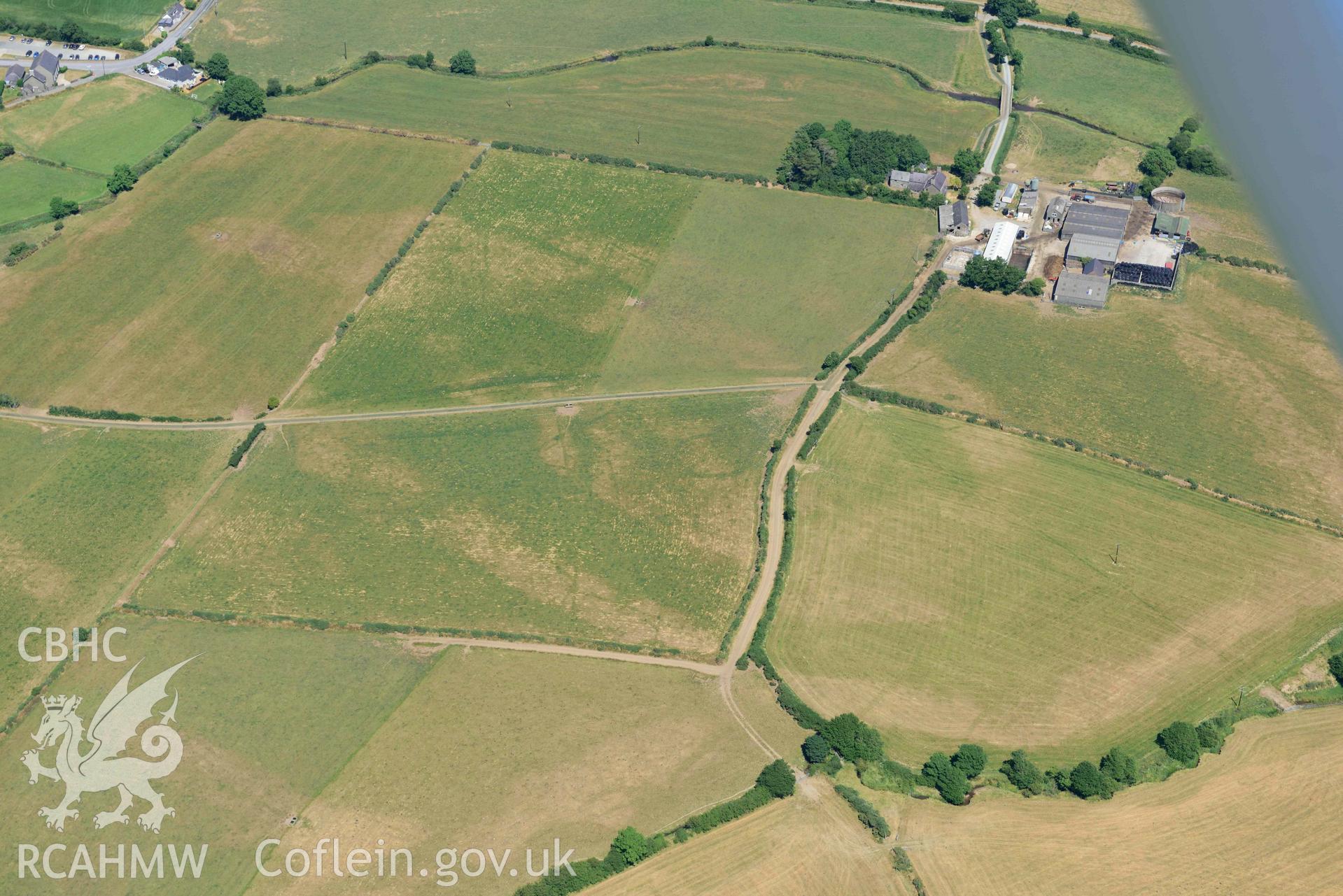 Aerial photograph: Trewen, Botwnnog. Cropmarks of a barrow and enclosures. Crown: CHERISH PROJECT 2018. Produced with EU funds through the Ireland Wales Co-operation Programme 2014-2020 (NGR SH262304)