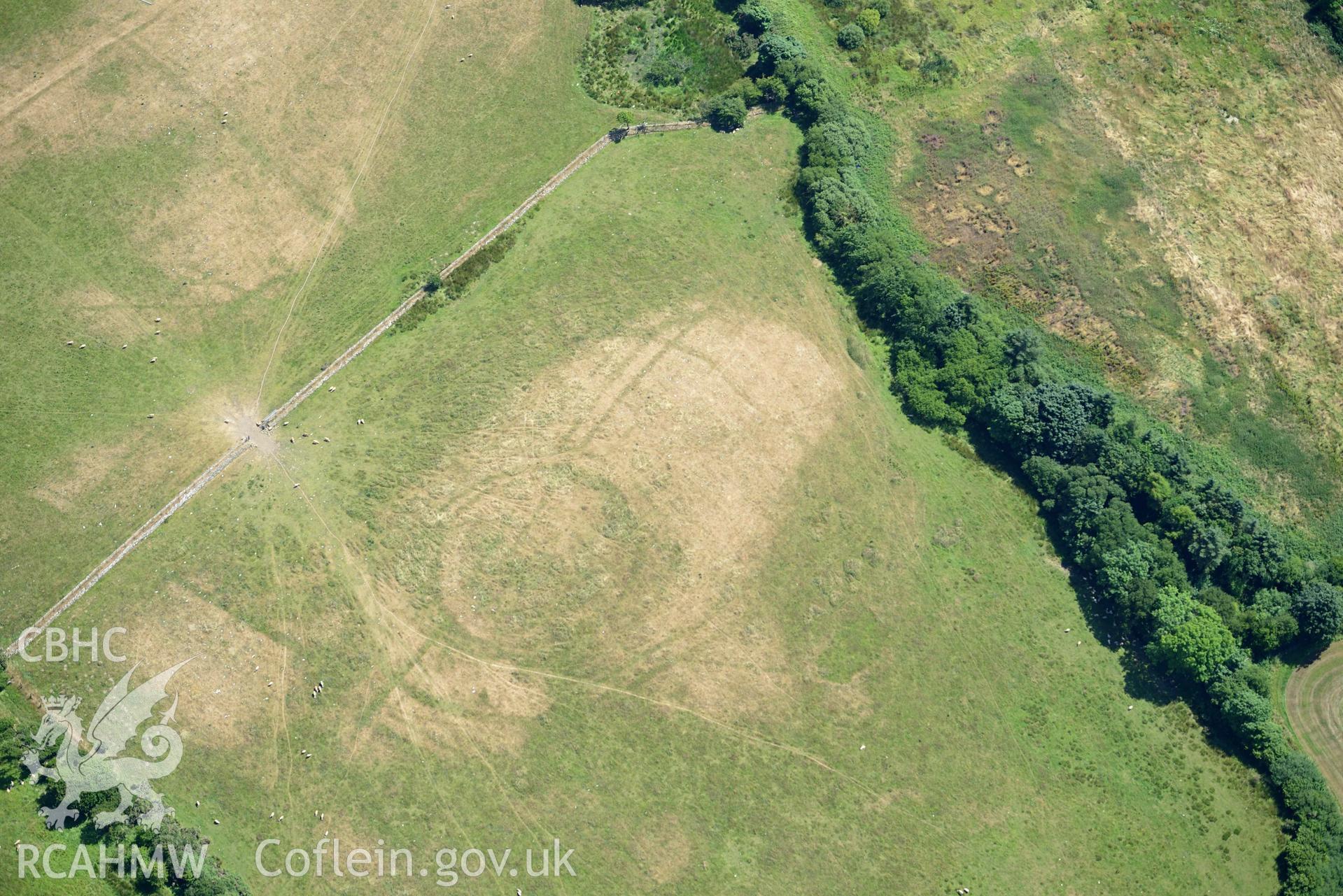 Aerial photograph: Llangian: cropmarks of early promontory enclosure, from south. Crown: CHERISH PROJECT 2018. Produced with EU funds through the Ireland Wales Co-operation Programme 2014-2020 (NGR SH294292)