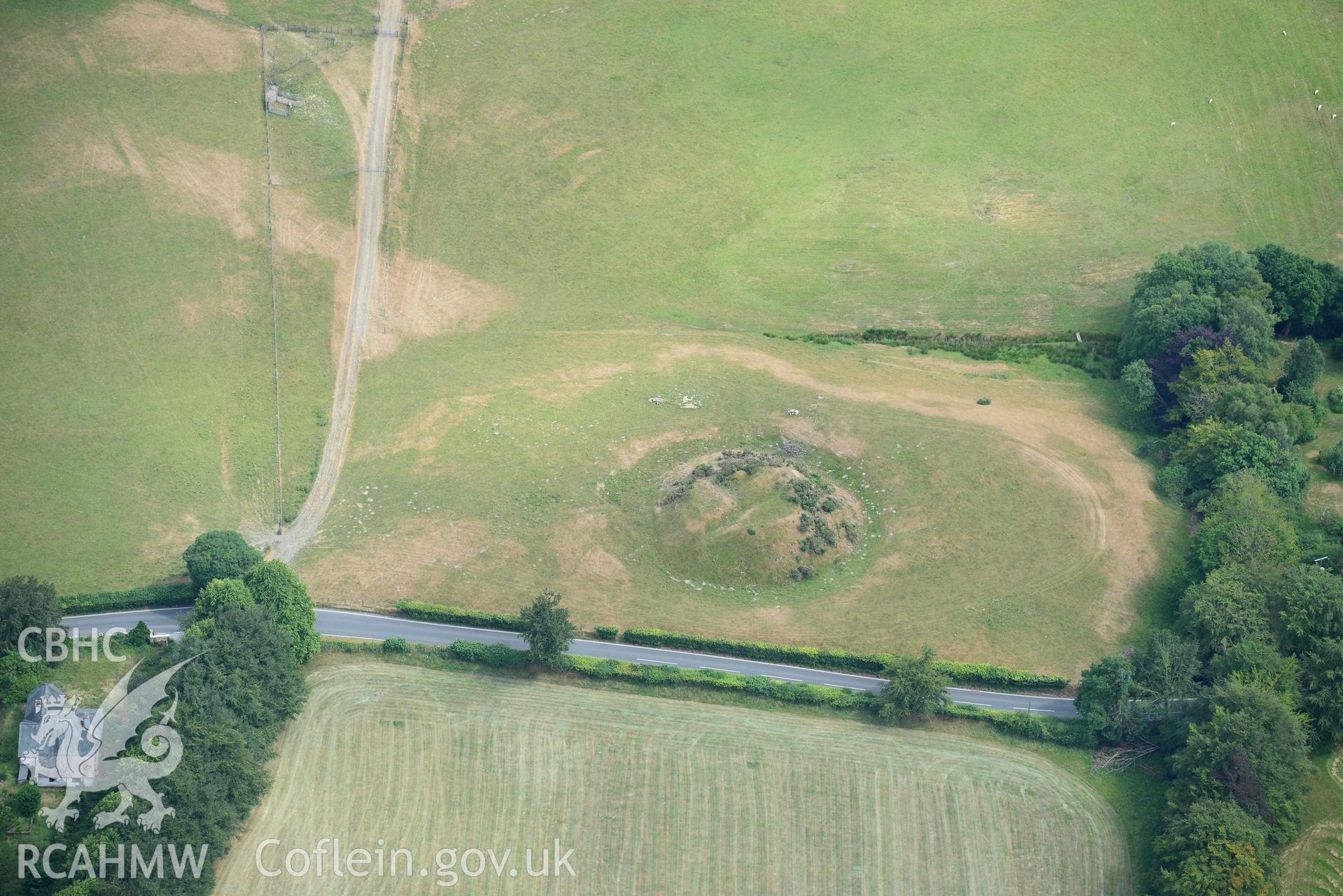 Aerial photograph: Tomen Llanio motte, with parchmarks. Crown: CHERISH PROJECT 2018. Produced with EU funds through the Ireland Wales Co-operation Programme 2014-2020 (NGR SN660579)