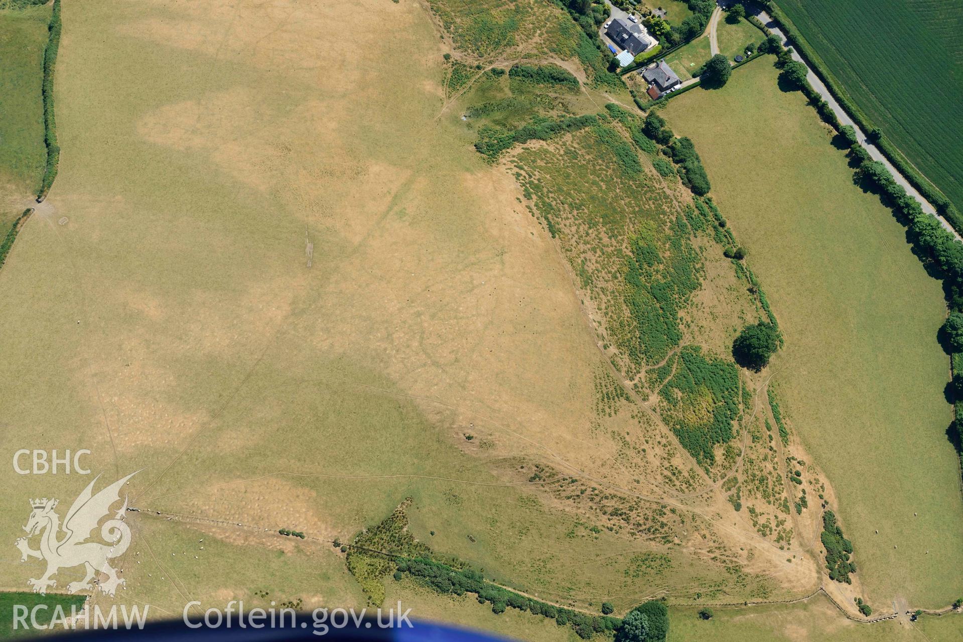 Aerial photograph: Llangian: cropmarks of early promontory enclosure, from north. Crown: CHERISH PROJECT 2018. Produced with EU funds through the Ireland Wales Co-operation Programme 2014-2020 (NGR SH294292)