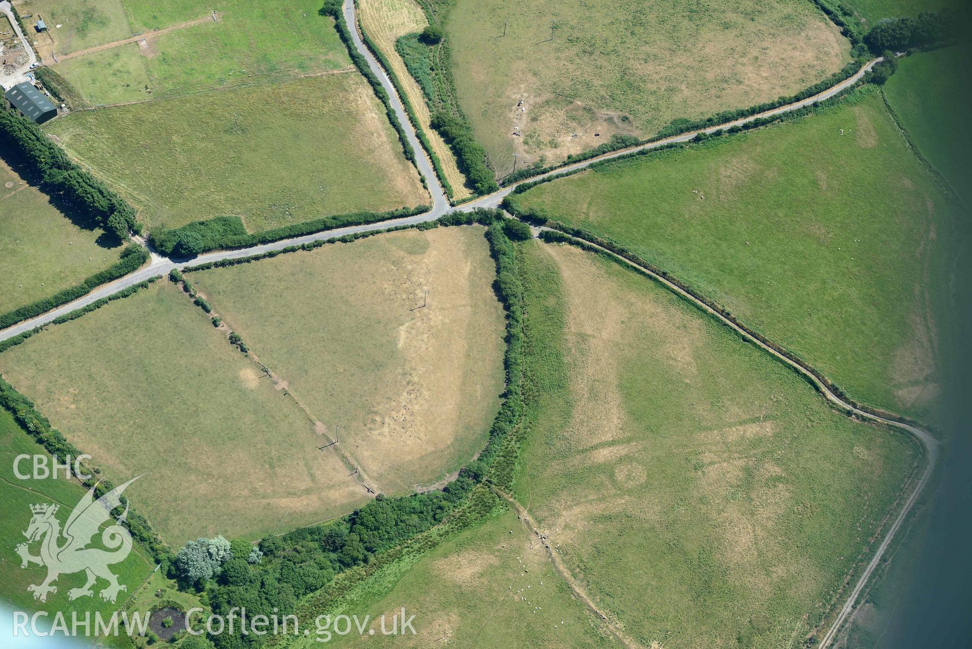 Aerial photograph: Llawr-Dref cropmark complex and barrows. Crown: CHERISH PROJECT 2018. Produced with EU funds through the Ireland Wales Co-operation Programme 2014-2020 (NGR SH291285)