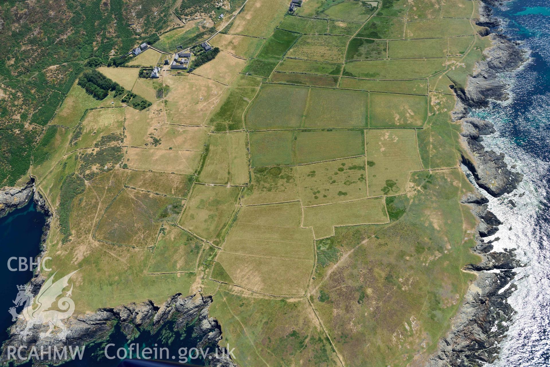 Aerial photograph: Ynys Enlli or Bardsey Island, Bae y Rhigol enclosures and field system, view from north. Crown: CHERISH PROJECT 2018. Produced with EU funds through the Ireland Wales Co-operation Programme 2014-2020 (NGR SH115224)