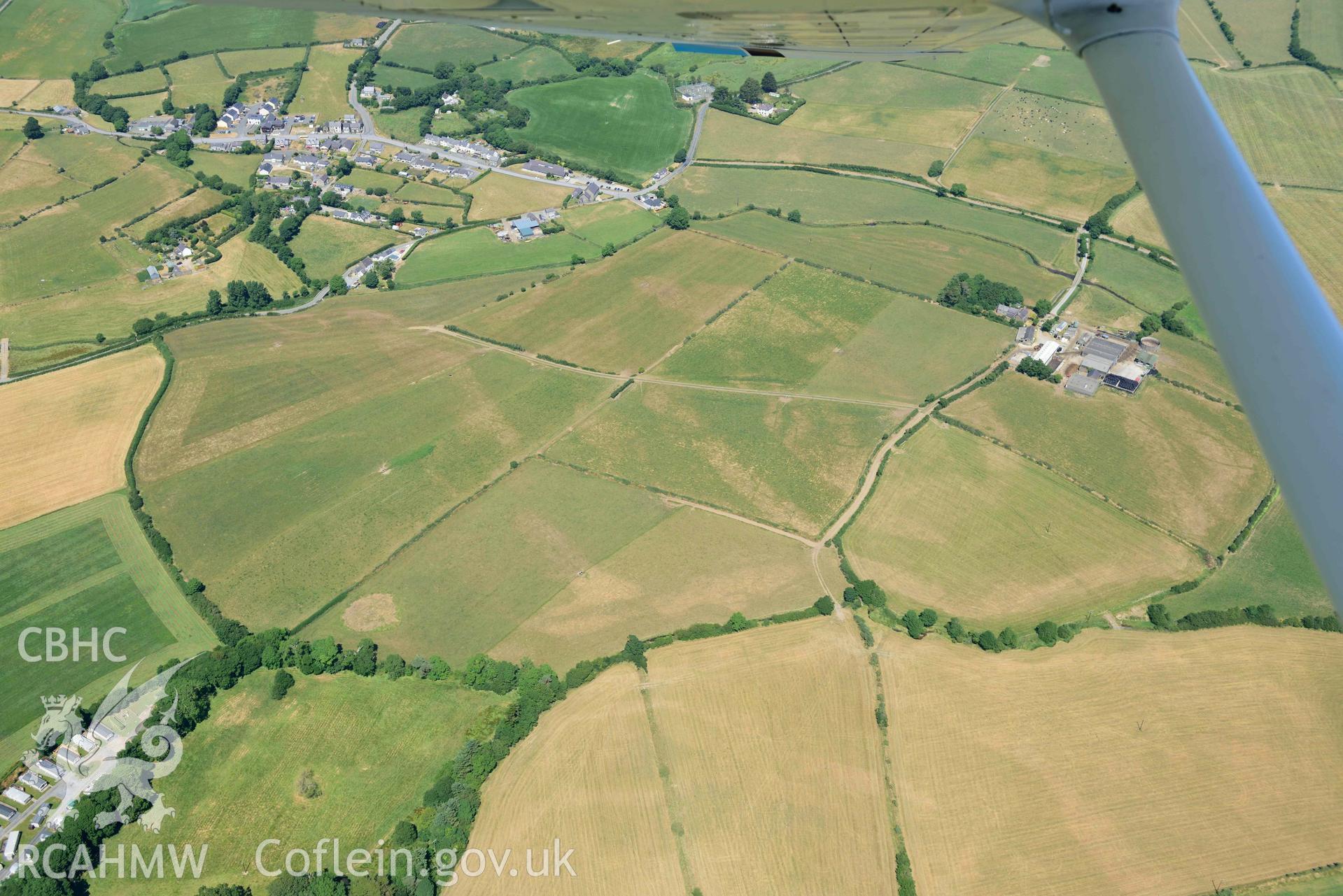 Aerial photograph: Trewen, Botwnnog. Cropmarks of a barrow and enclosures. Crown: CHERISH PROJECT 2018. Produced with EU funds through the Ireland Wales Co-operation Programme 2014-2020 (NGR SH262304)