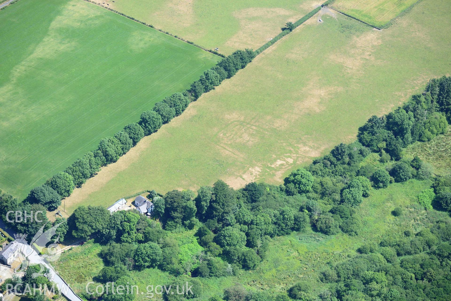 Aerial photograph: Pont Rhyd-hir defended enclosure cropmark. Crown: CHERISH PROJECT 2018. Produced with EU funds through the Ireland Wales Co-operation Programme 2014-2020 (NGR SH346355)