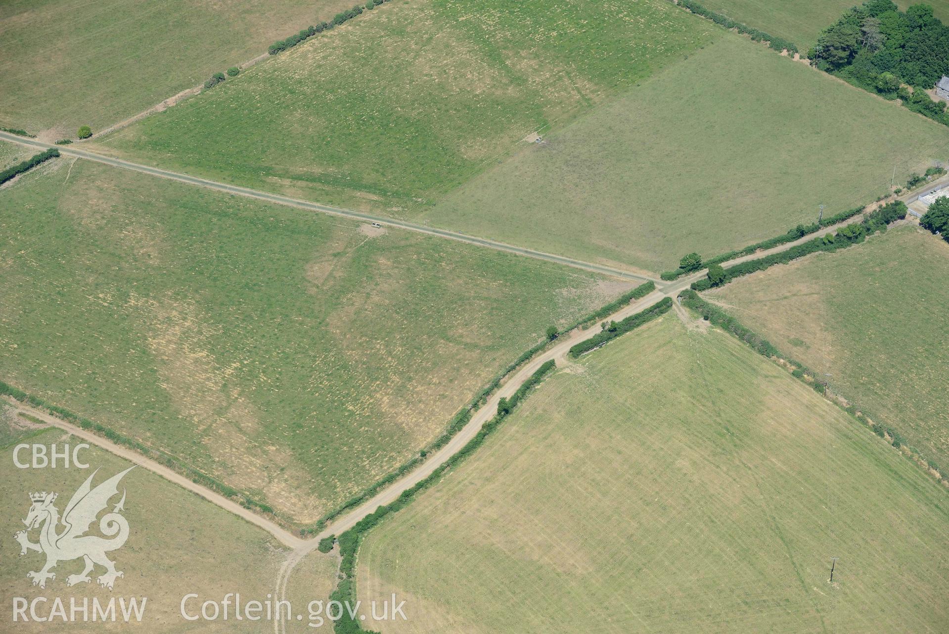 Aerial photograph: Trewen, Botwnnog. Cropmarks of a barrow and enclosures. Crown: CHERISH PROJECT 2018. Produced with EU funds through the Ireland Wales Co-operation Programme 2014-2020 (NGR SH262304)